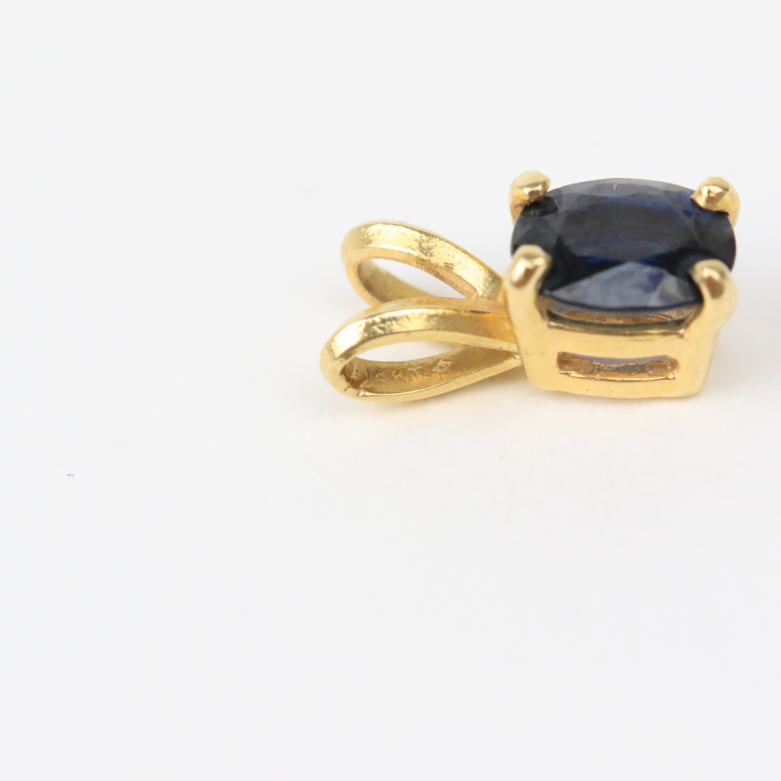 Pair of 14K Yellow Gold and Sapphire Solitaire Pendants