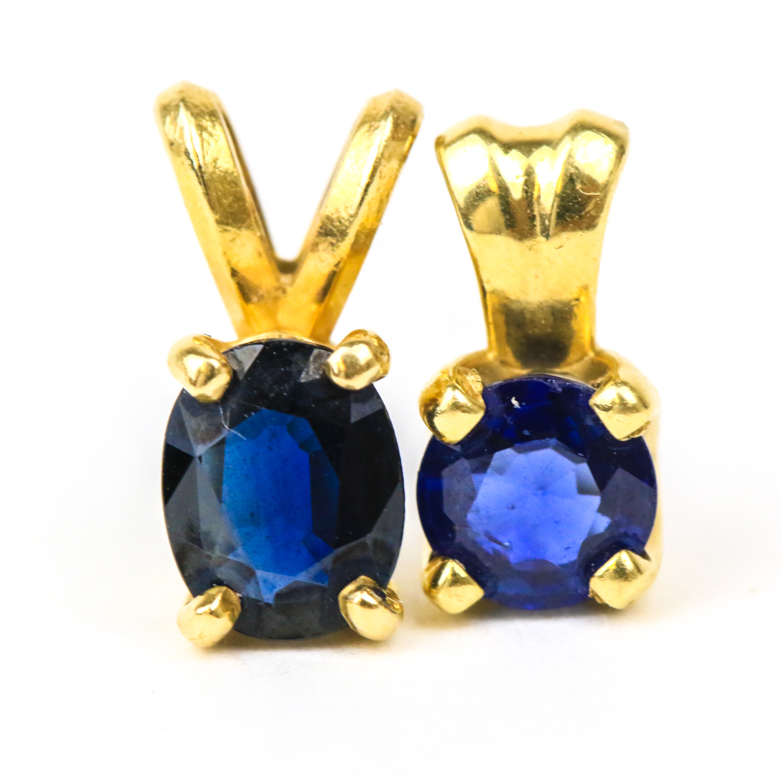 Pair of 14K Yellow Gold and Sapphire Solitaire Pendants