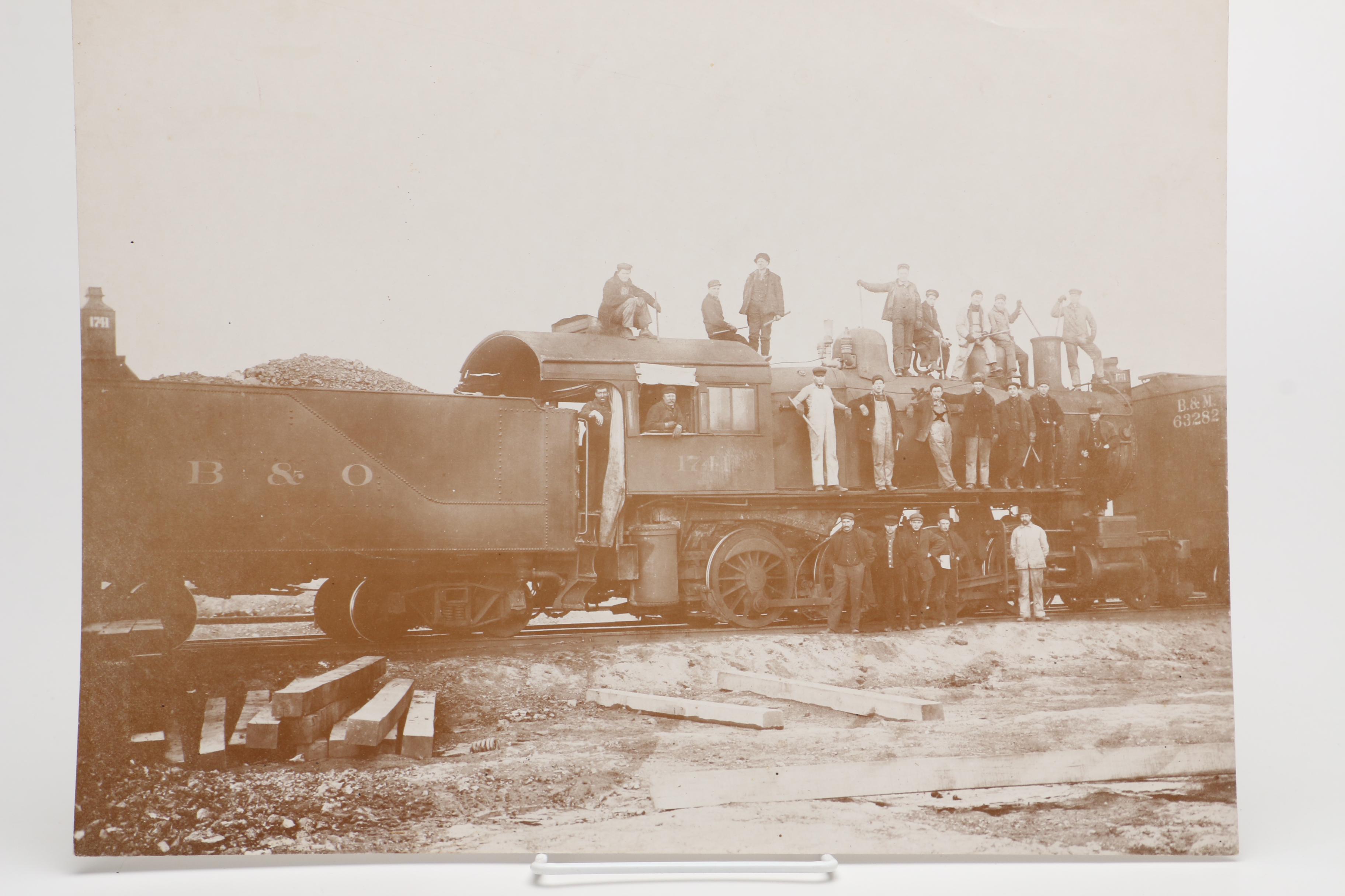 Sepia Tone Photographs of Trains and Steamboat