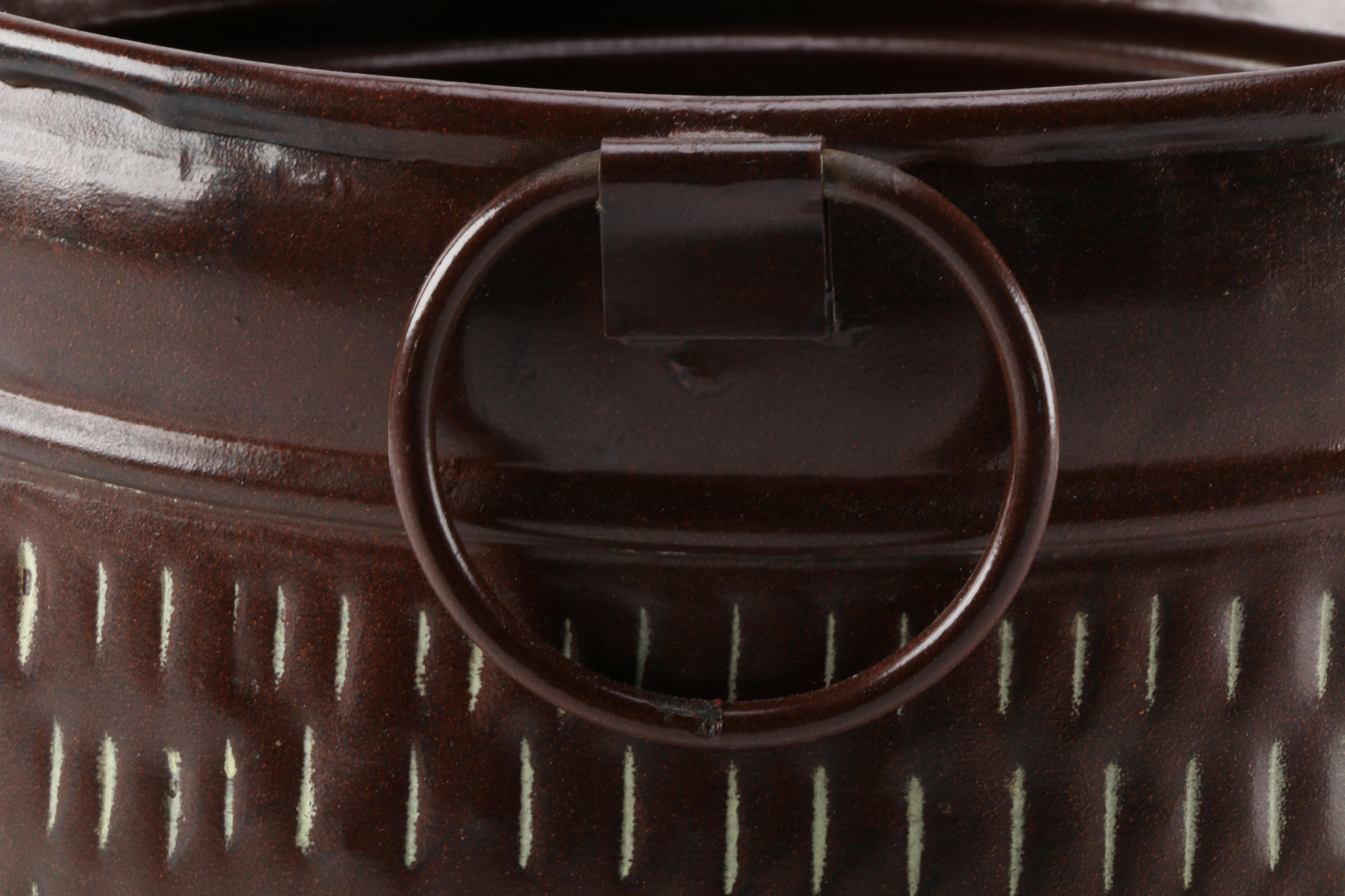 Embossed Brown Metal Container
