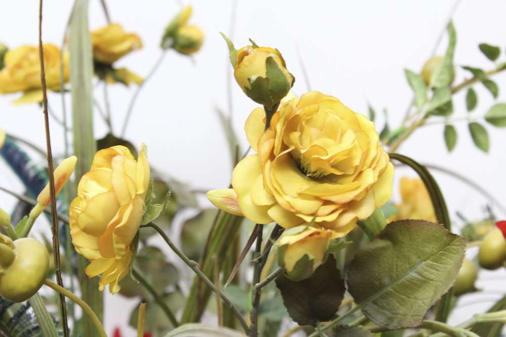 Footed Urn With Decorative Silk Flower Arrangement