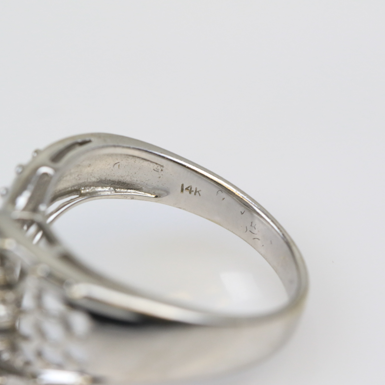 14K White Gold, Tanzanite, and Emerald Pierced Flower Ring