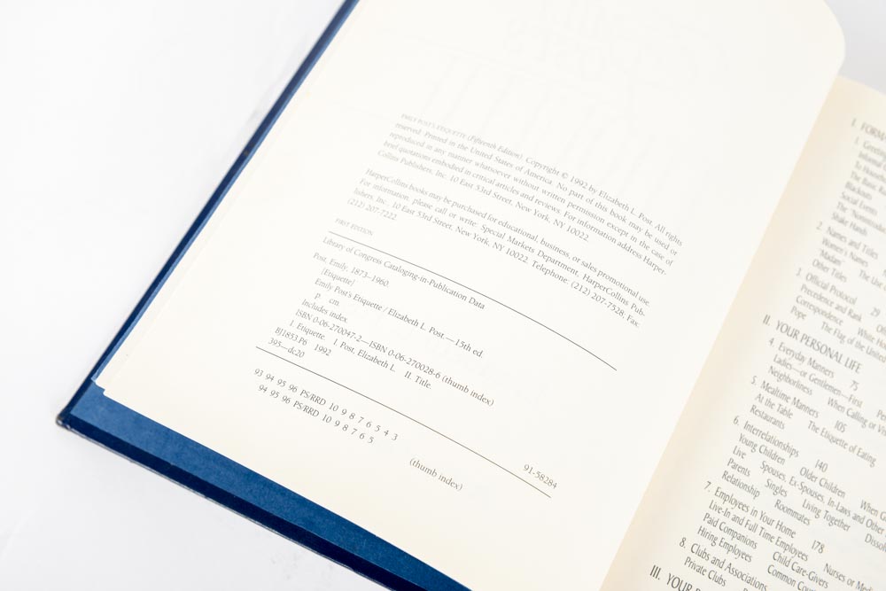 Copy of "Etiquette" by Emily Post with Ceramic Cat Figurine