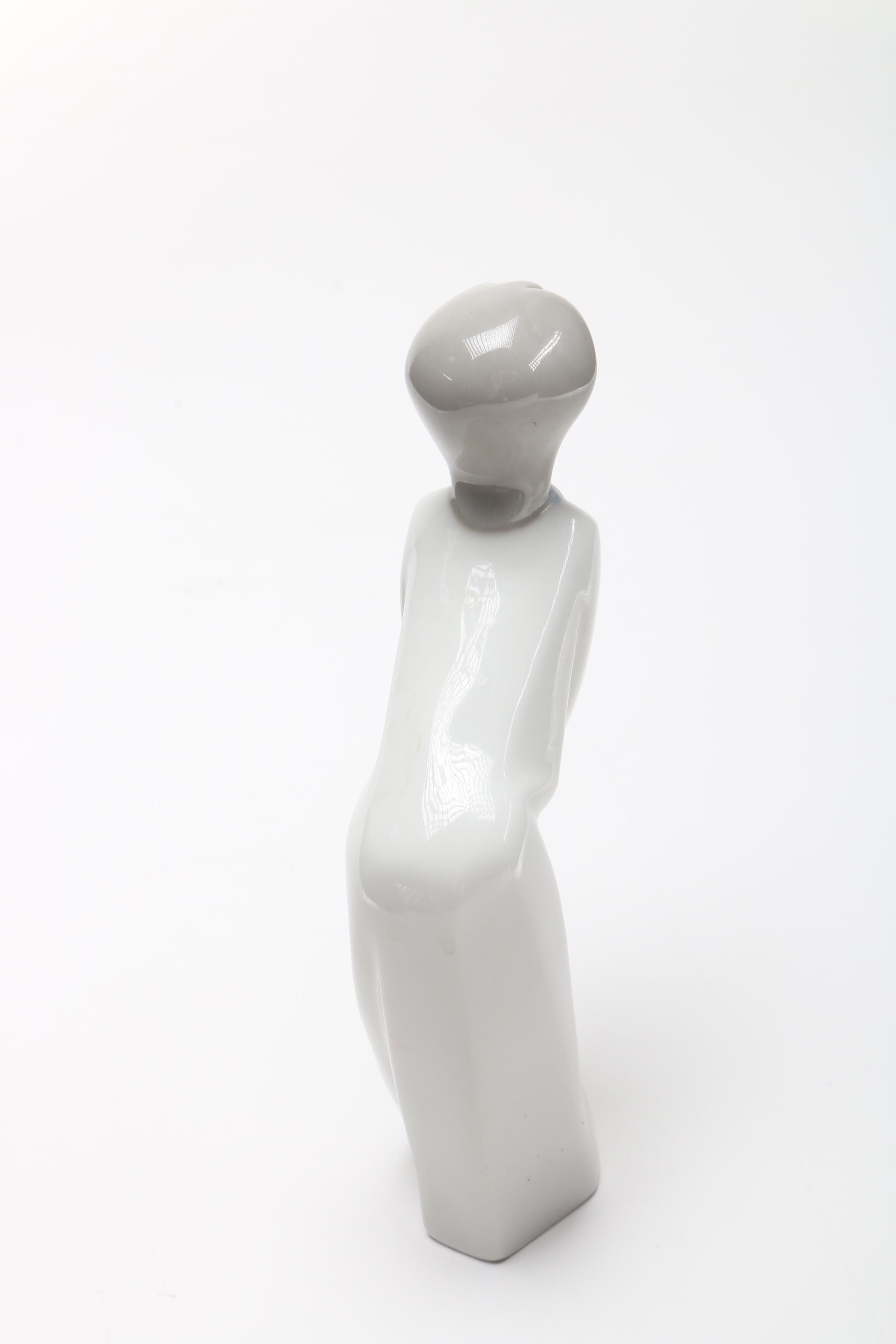 Lladró "Girl Kissing" Figurine