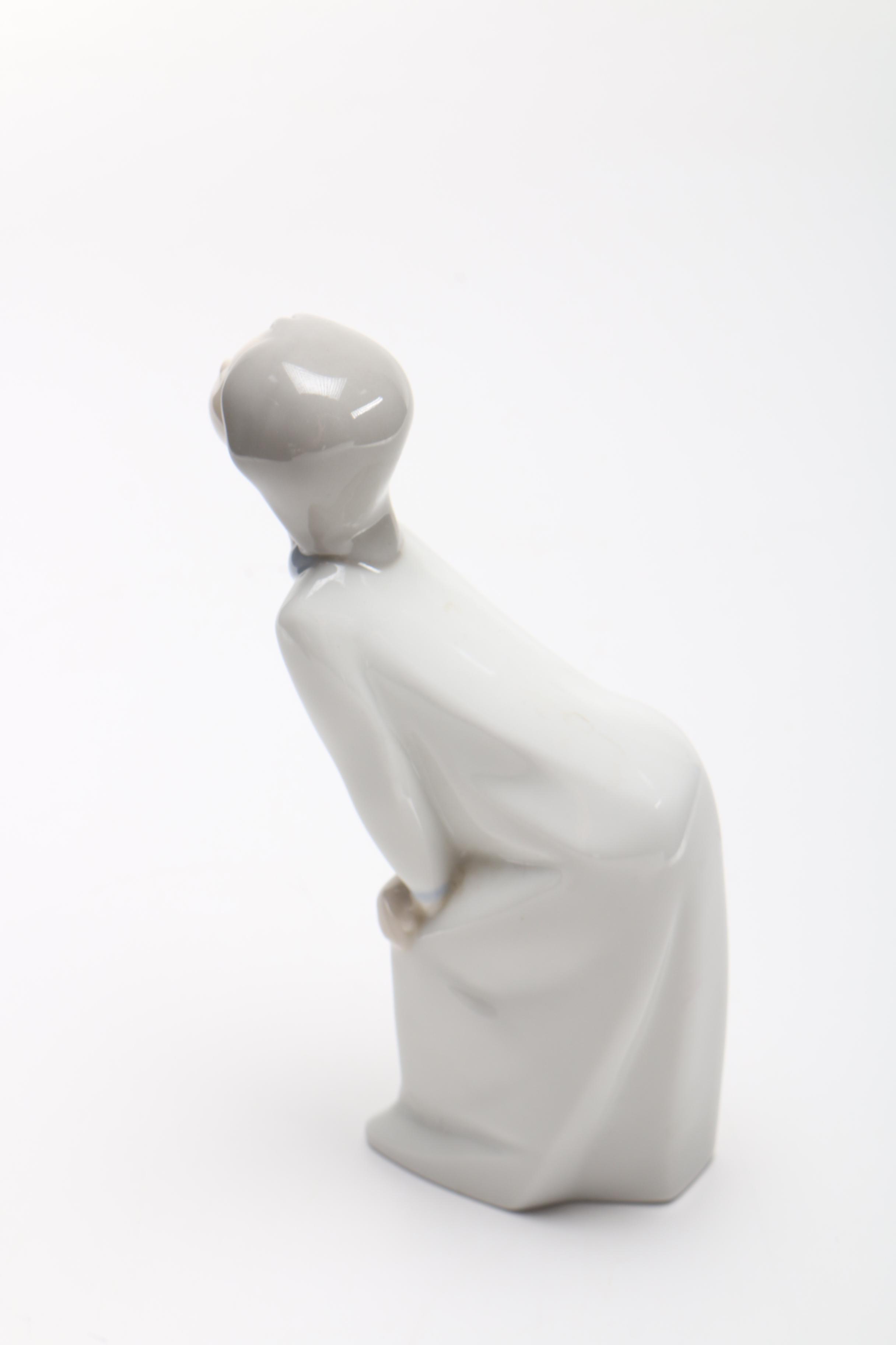 Lladró "Girl Kissing" Figurine