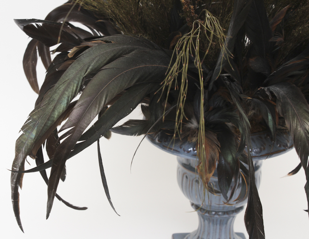 Floral and Feather Arrangement in Decorative Urn