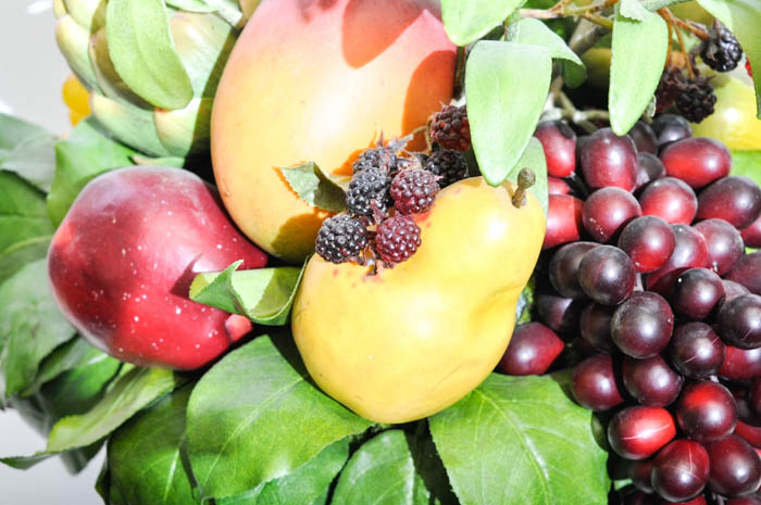 Footed Urn With Decorative Silk Flower And Fruit Arrangement