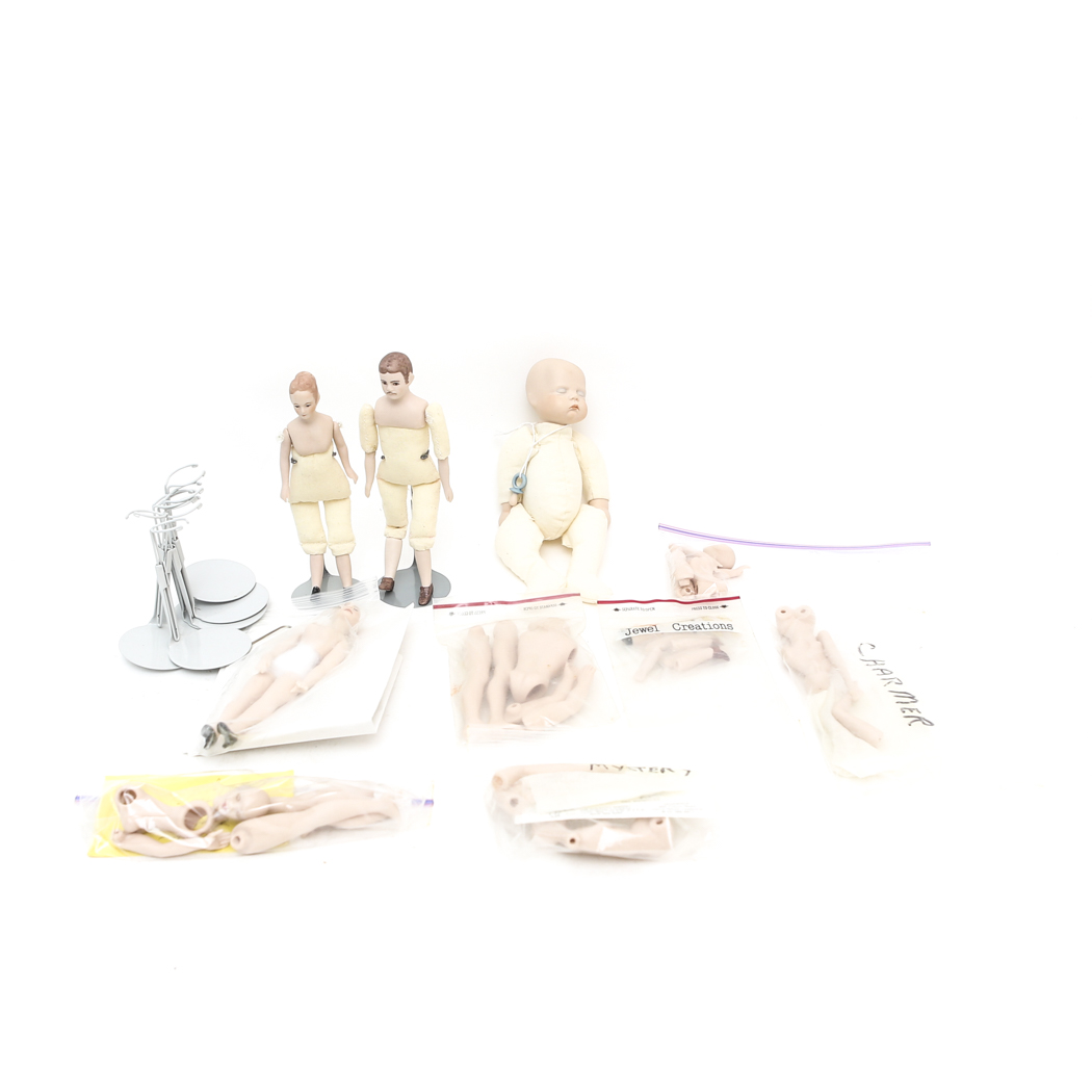 Collection of Small Doll Parts and Stands