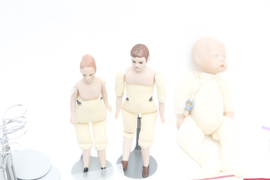 Collection of Small Doll Parts and Stands