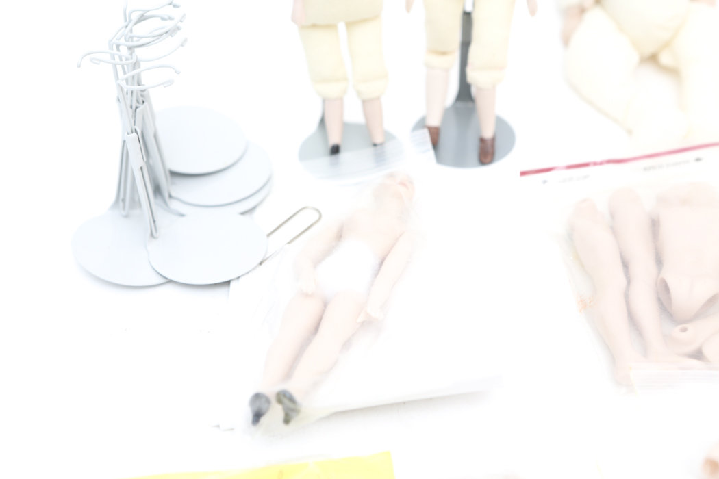 Collection of Small Doll Parts and Stands