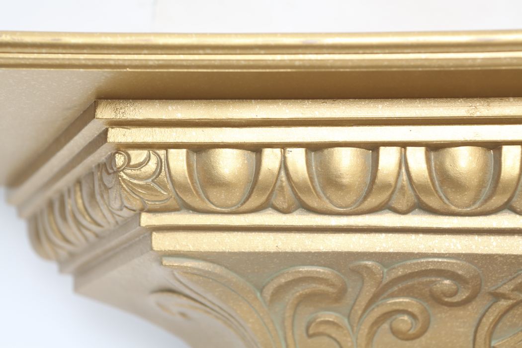 An Ornate Gold Wall Shelf and an Angel Figurine