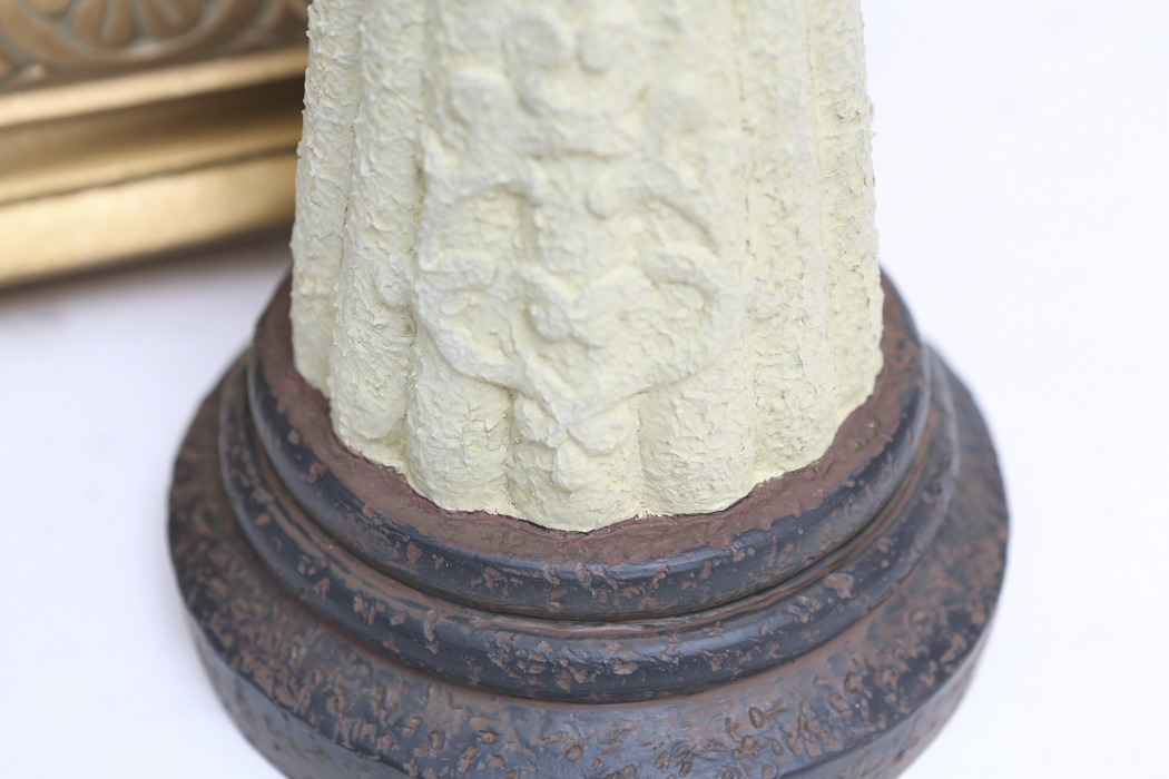 An Ornate Gold Wall Shelf and an Angel Figurine