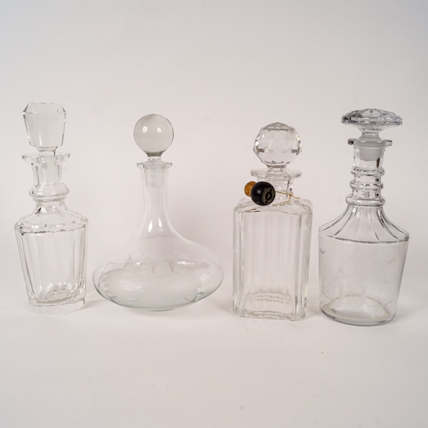 Collection of Etched Clear Liquor Decanters and Stoppers