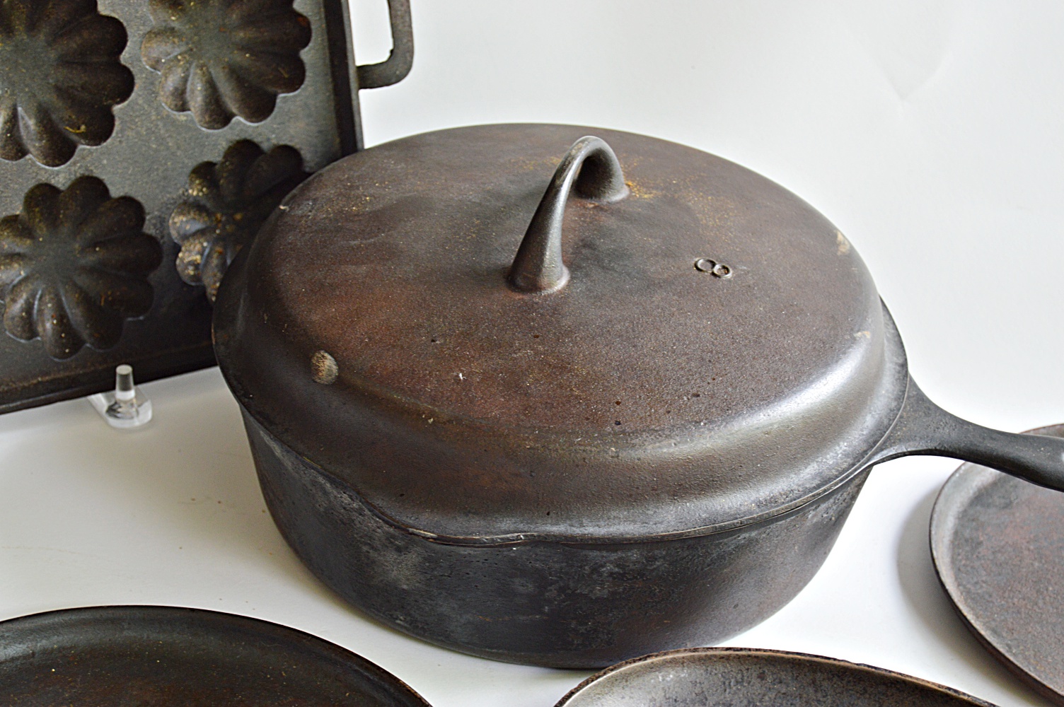Seven Pieces of Vintage Cast Iron Cookware