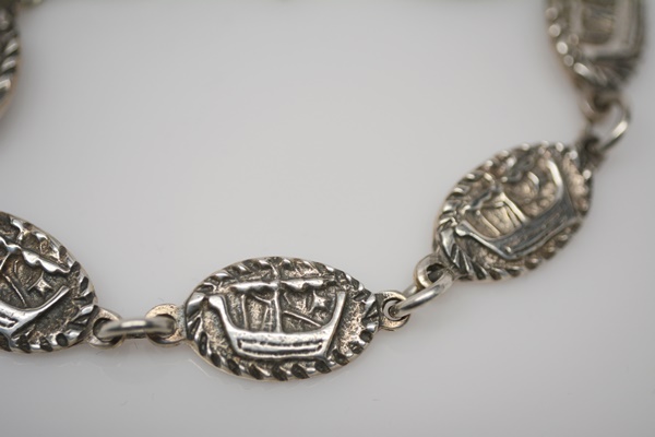 Three Themed Sterling Silver Brooches and One Bracelet