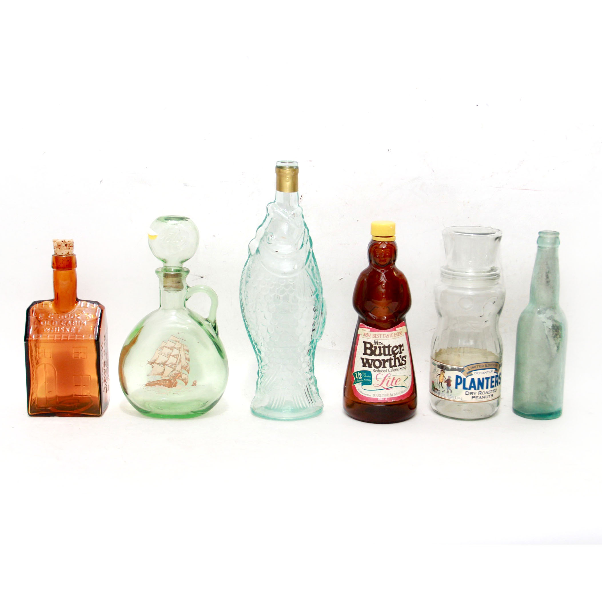 Vintage Glass Advertising Bottles Featuring Planters Peanuts