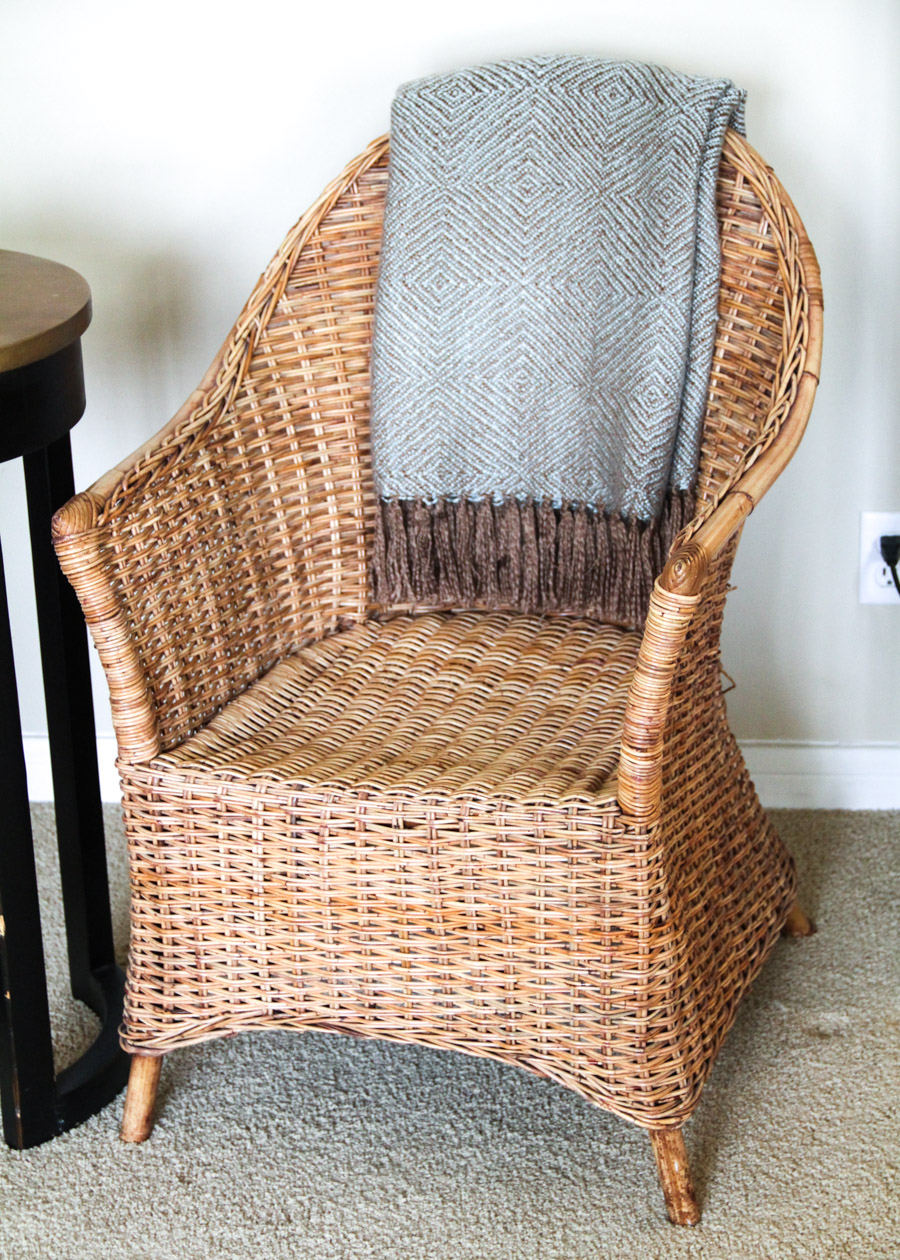 Wicker Chair with Side Table, Throw, and Votive