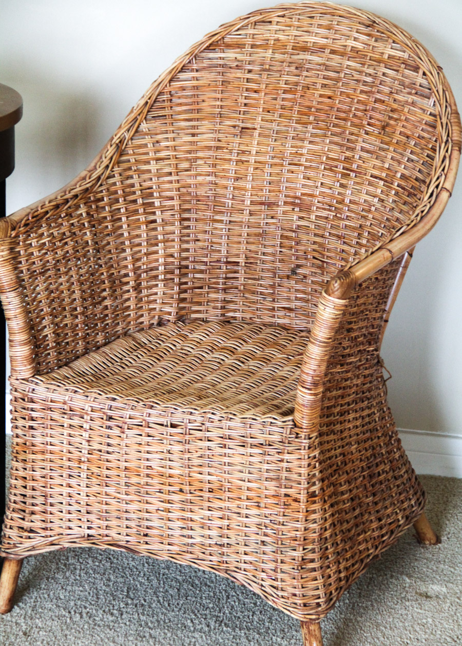 Wicker Chair with Side Table, Throw, and Votive