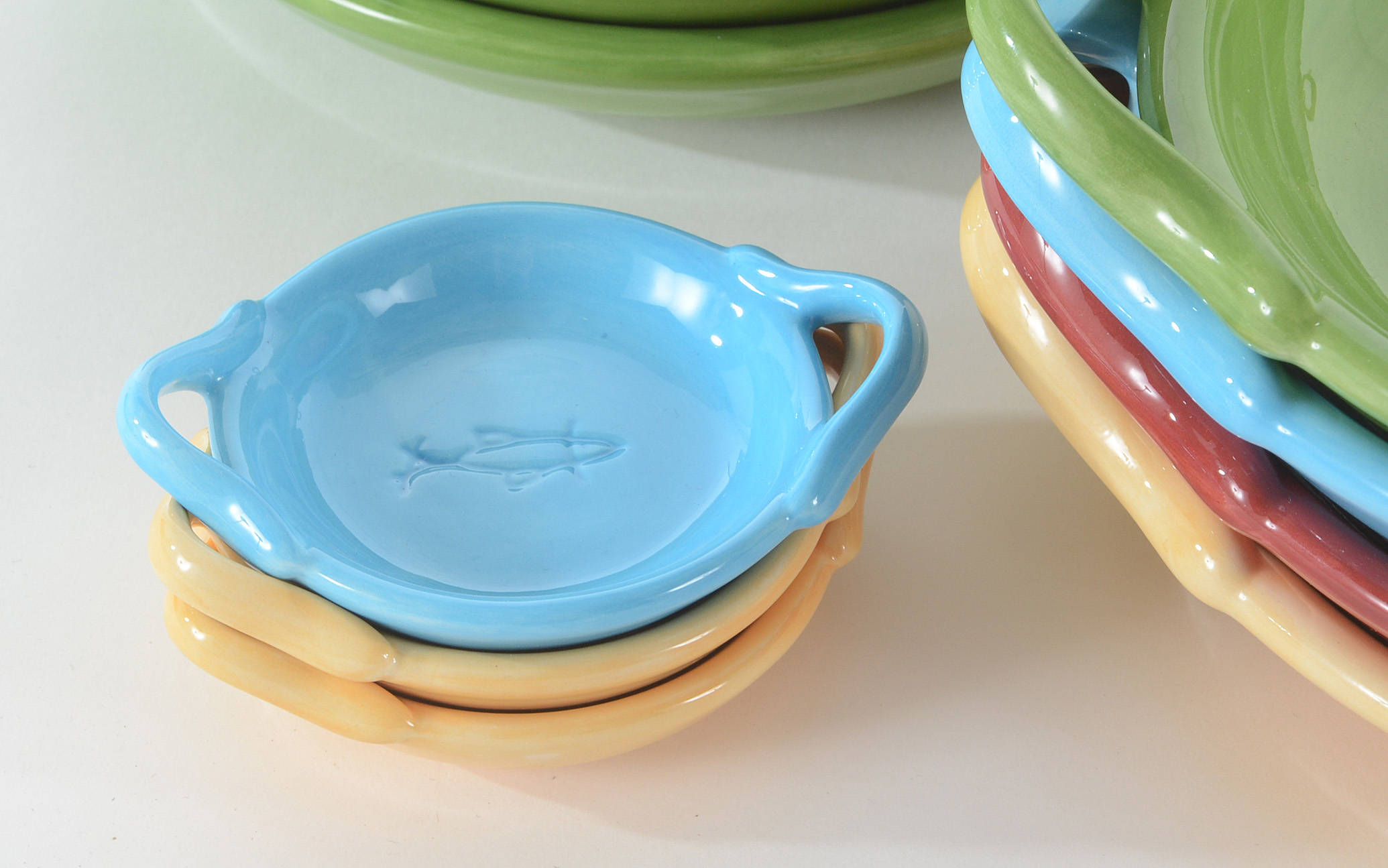 Collection of Pottery Barn Fiesta Ware Dishes and Placemats