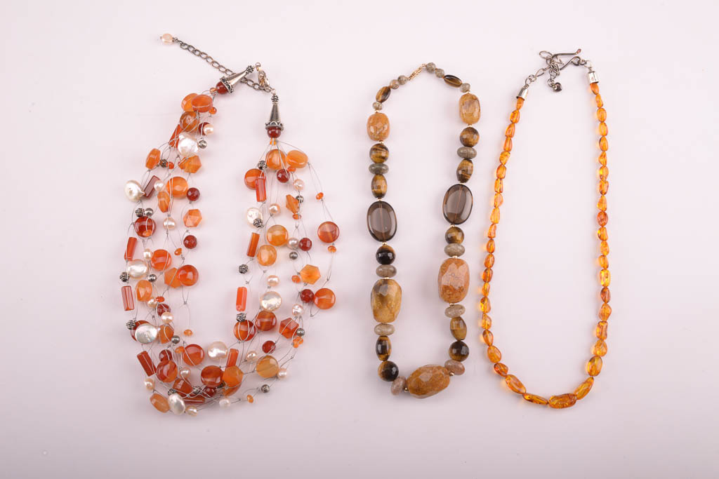Collection of Red, Orange, and Brown Beaded Fashion Jewelry