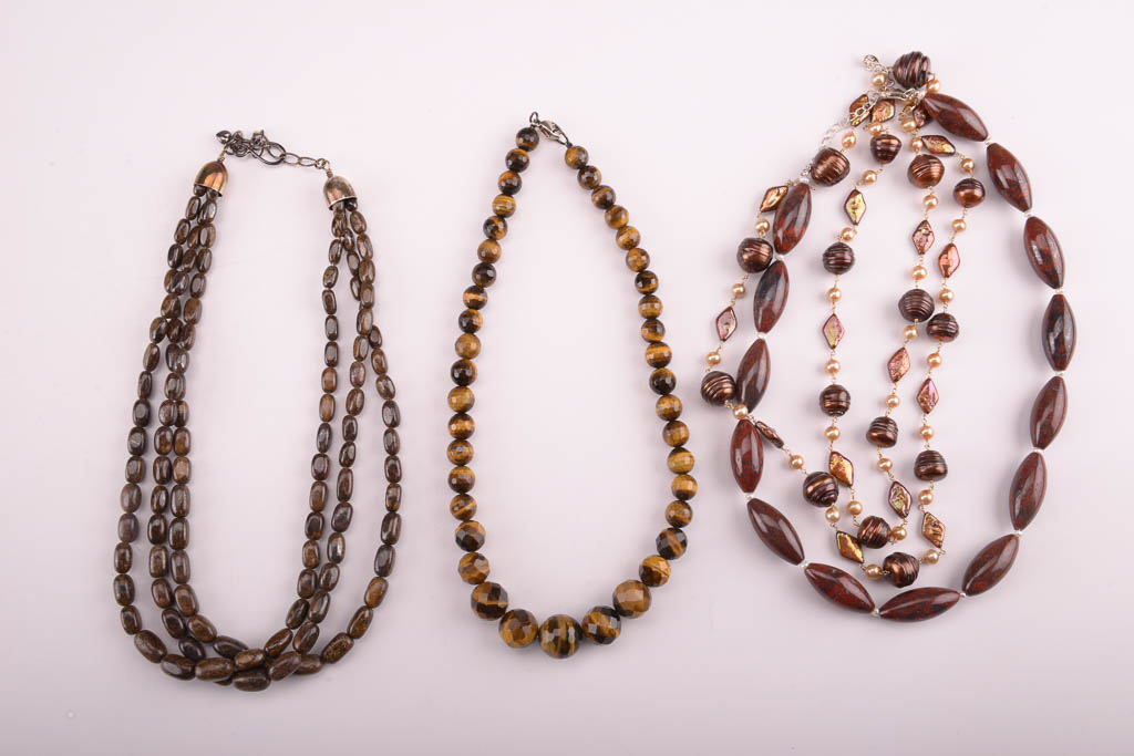Collection of Red, Orange, and Brown Beaded Fashion Jewelry