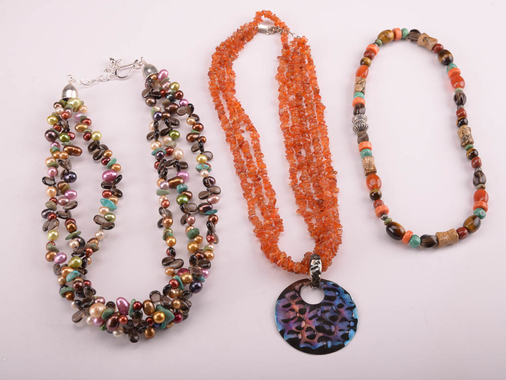 Collection of Red, Orange, and Brown Beaded Fashion Jewelry