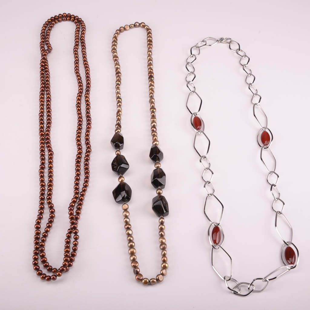 Collection of Red, Orange, and Brown Beaded Fashion Jewelry