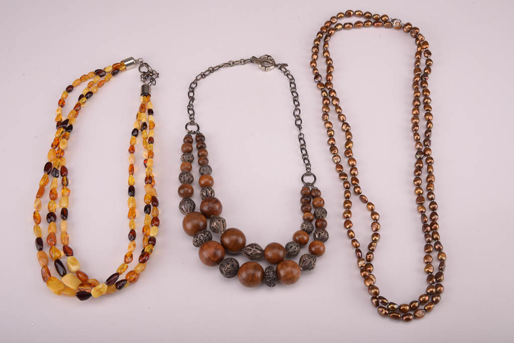 Collection of Red, Orange, and Brown Beaded Fashion Jewelry