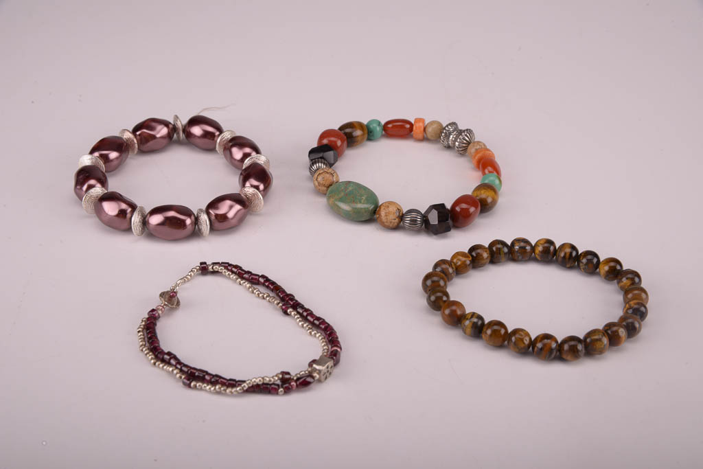 Collection of Red, Orange, and Brown Beaded Fashion Jewelry
