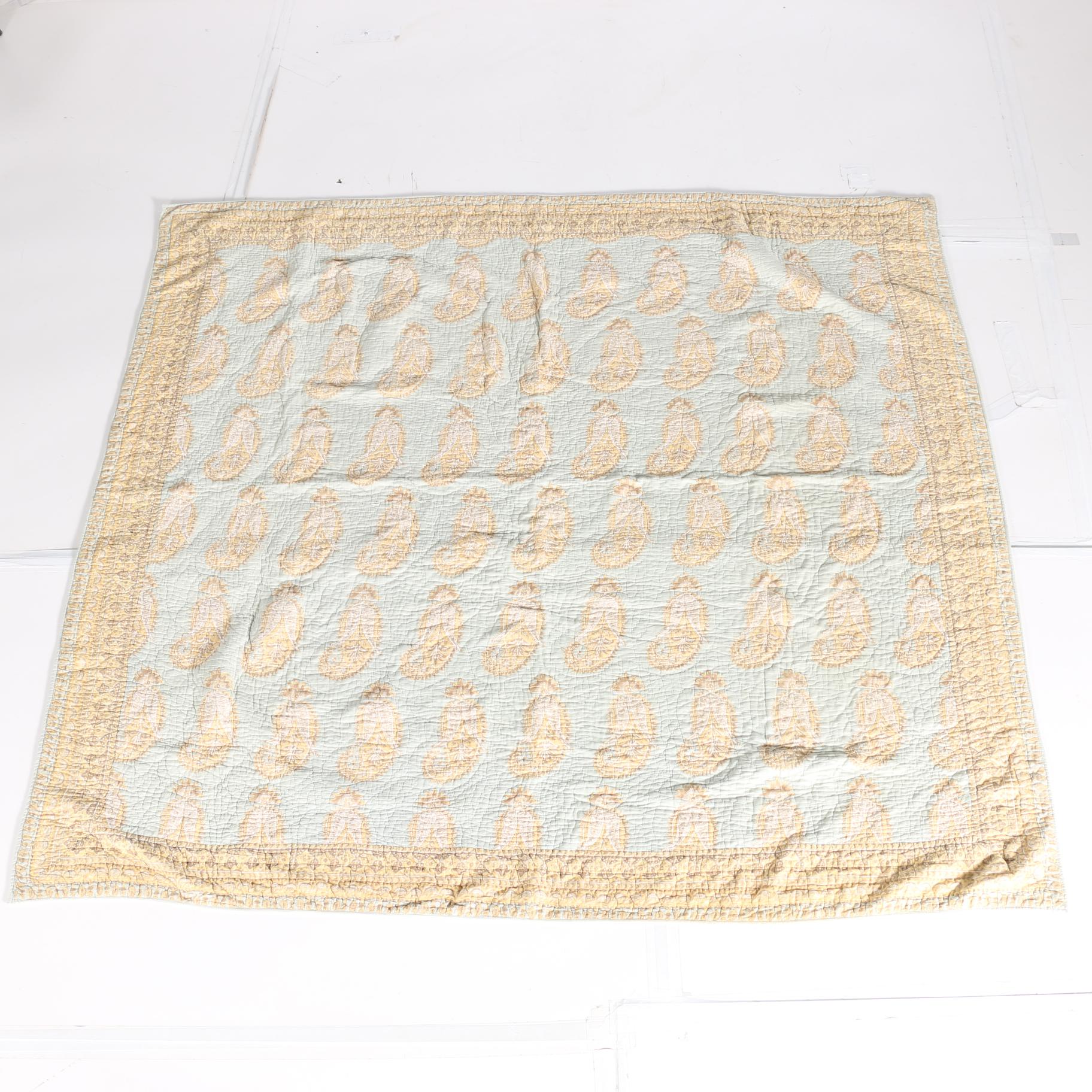 Blue and Tan Quilted Bedspread