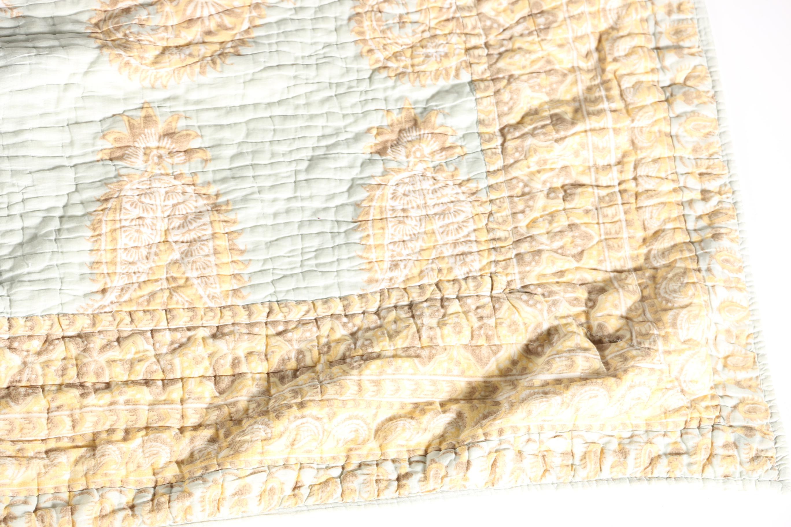 Blue and Tan Quilted Bedspread