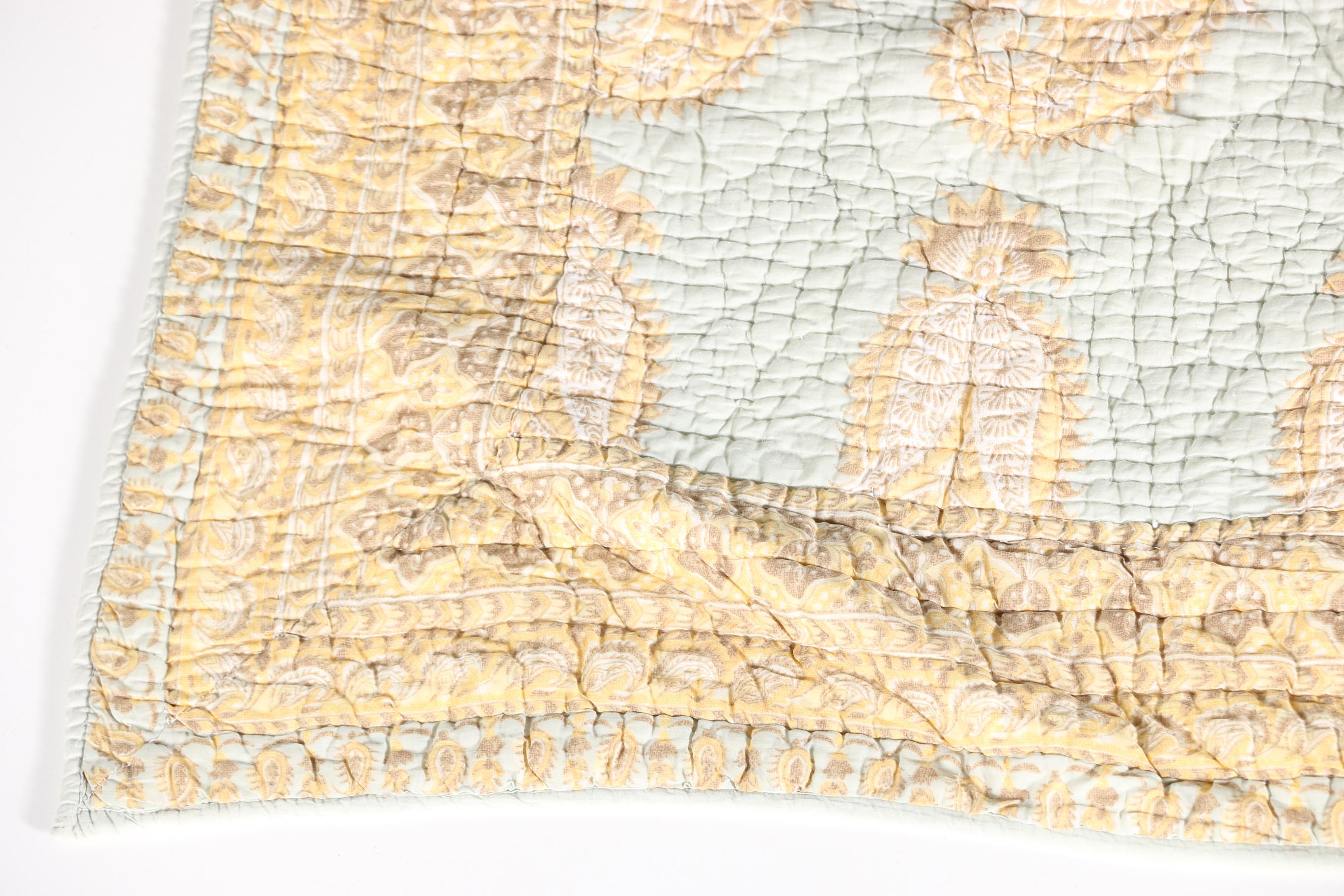 Blue and Tan Quilted Bedspread