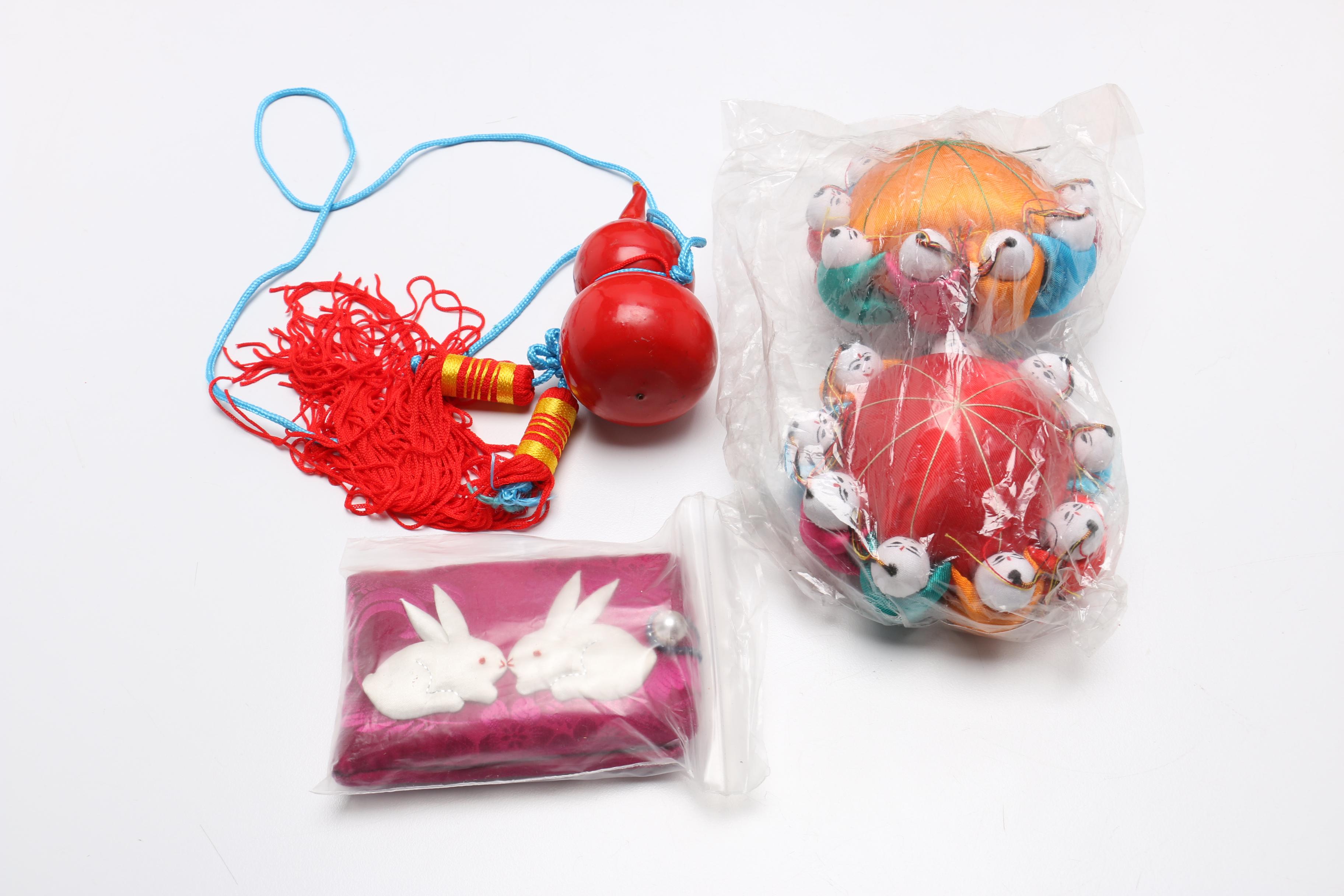 Large Assortment of Chinese Souvenirs Including Meerschaum Jewelry and Panda Items