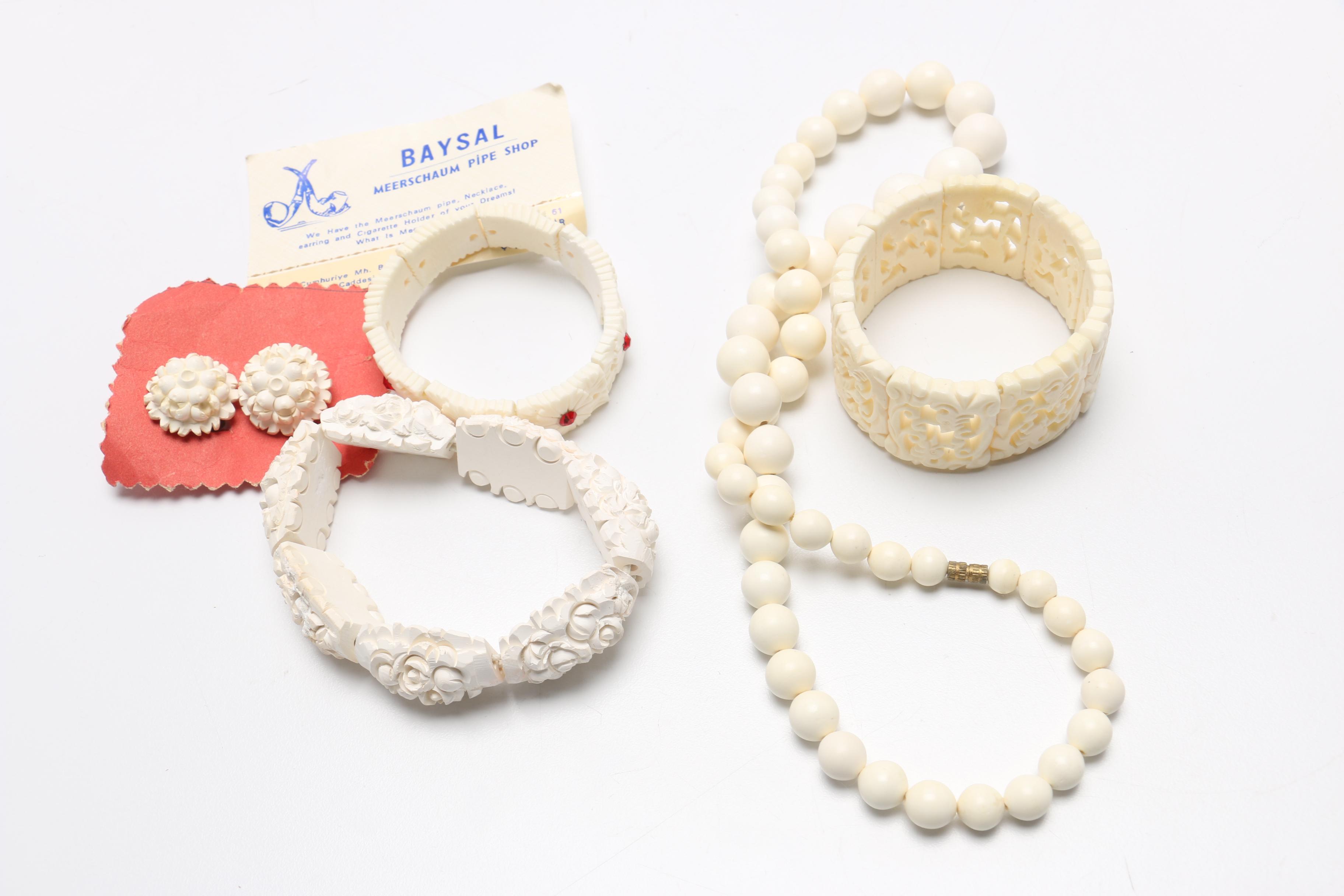 Large Assortment of Chinese Souvenirs Including Meerschaum Jewelry and Panda Items