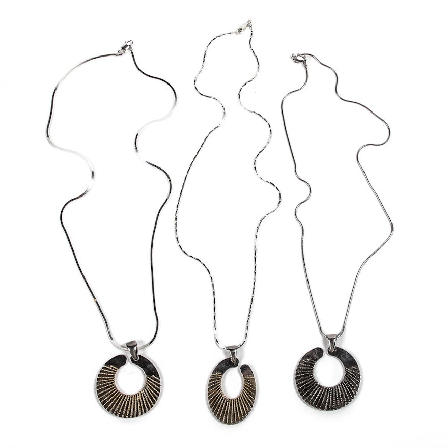 Three Silver Necklaces With Silver Pendants