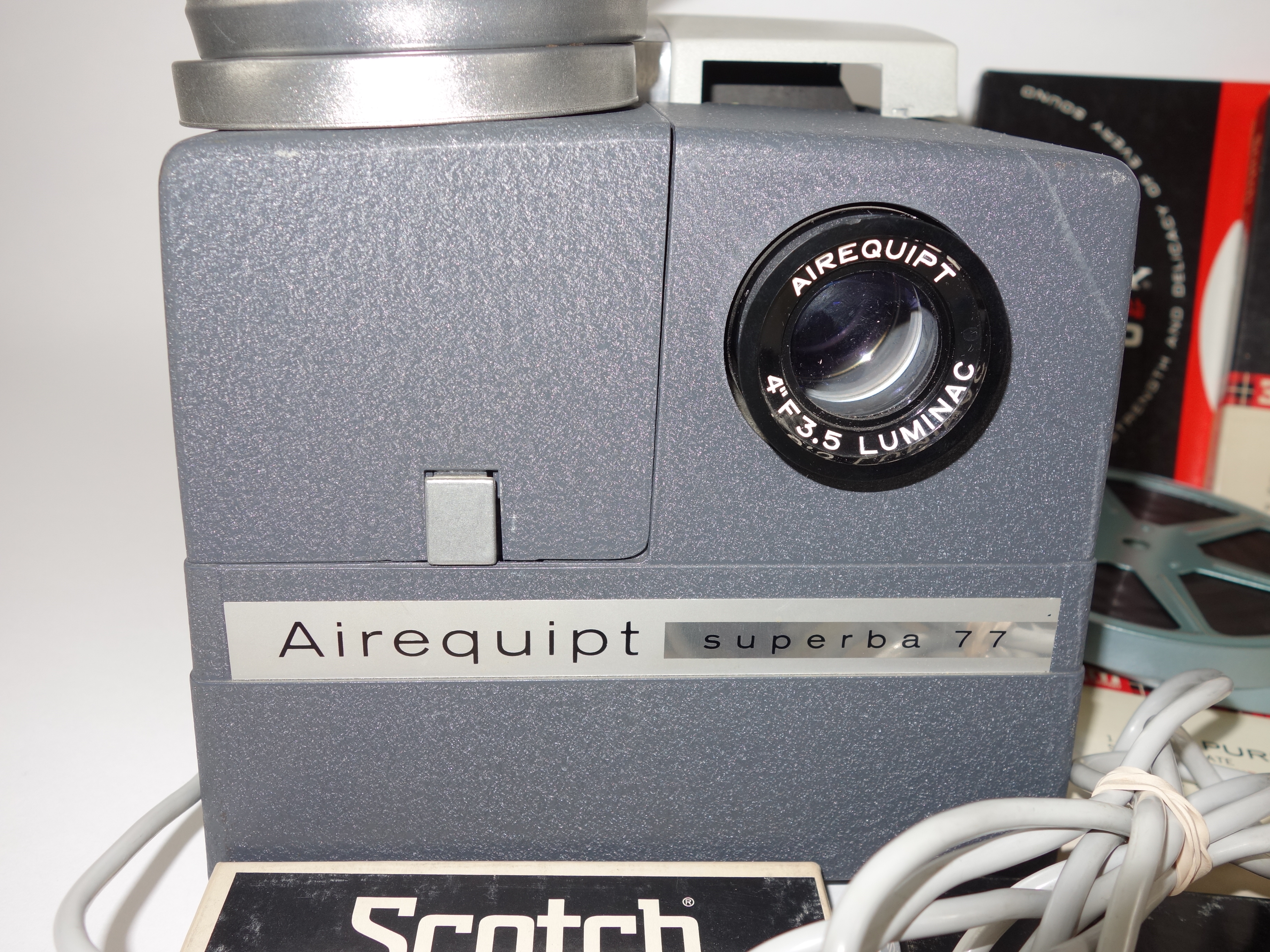 Projector and Vintage Tape Reels With News, Other Recordings