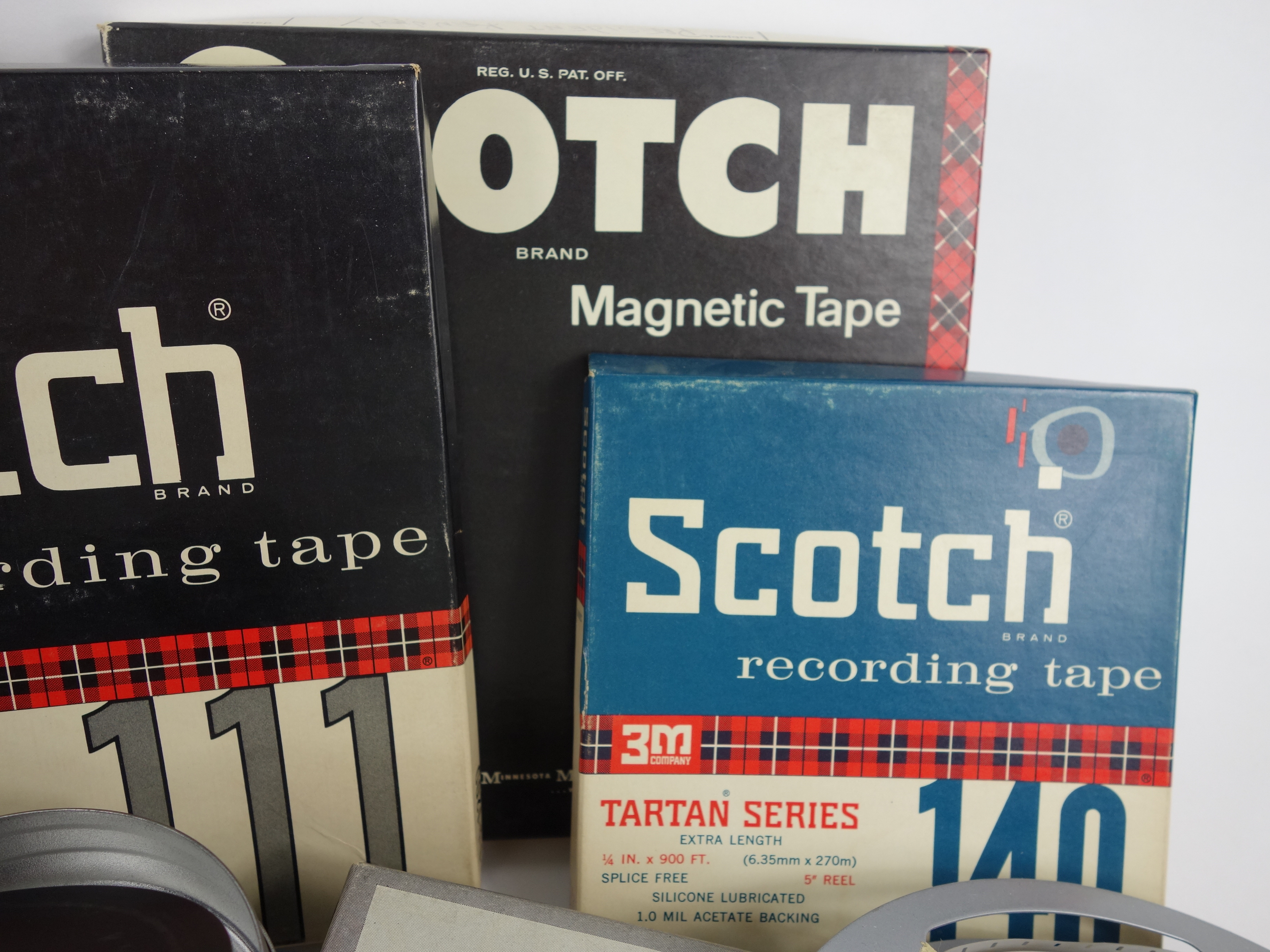 Projector and Vintage Tape Reels With News, Other Recordings