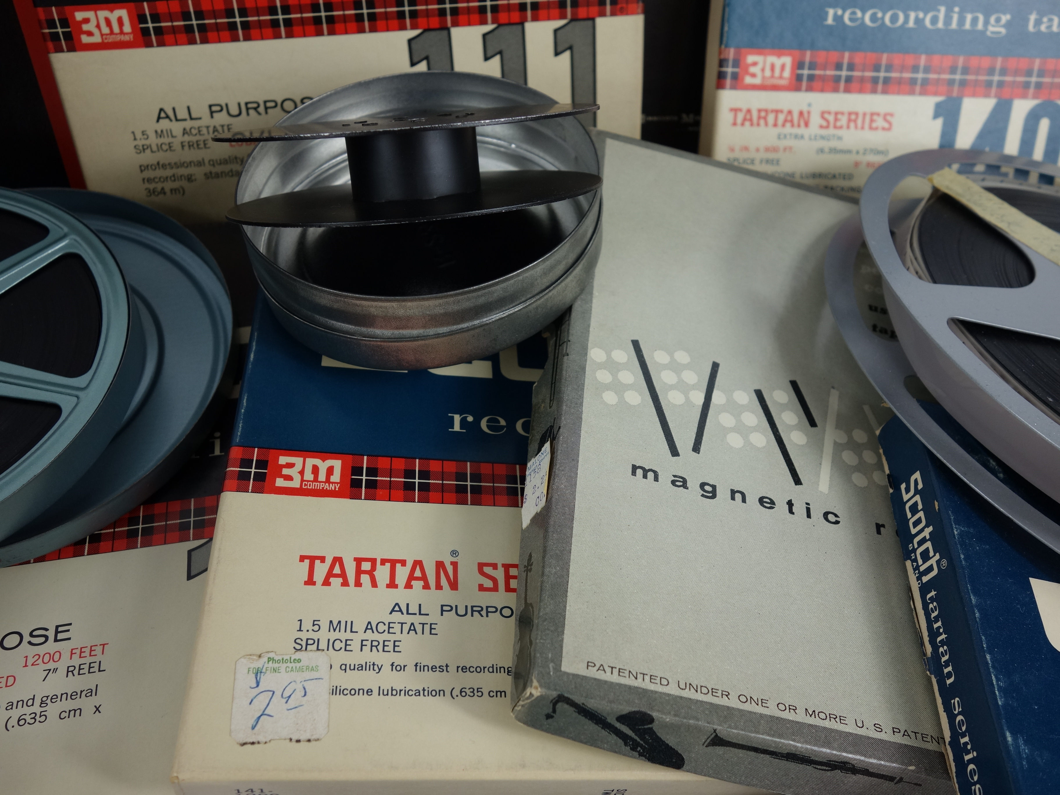 Projector and Vintage Tape Reels With News, Other Recordings