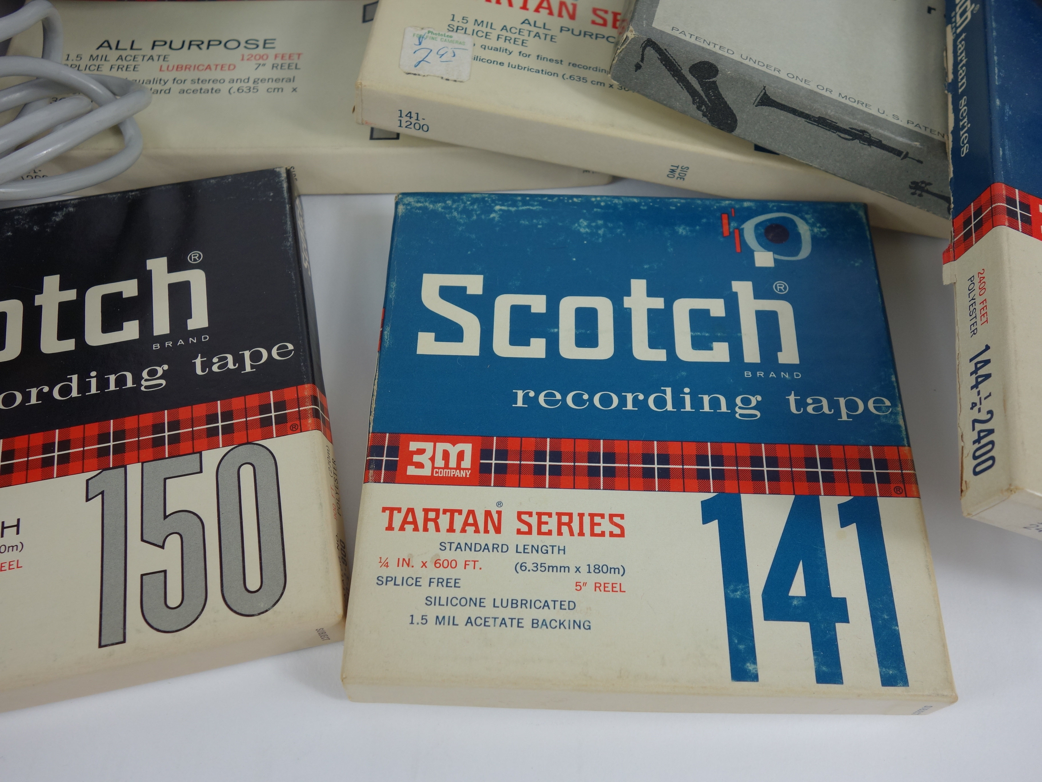 Projector and Vintage Tape Reels With News, Other Recordings