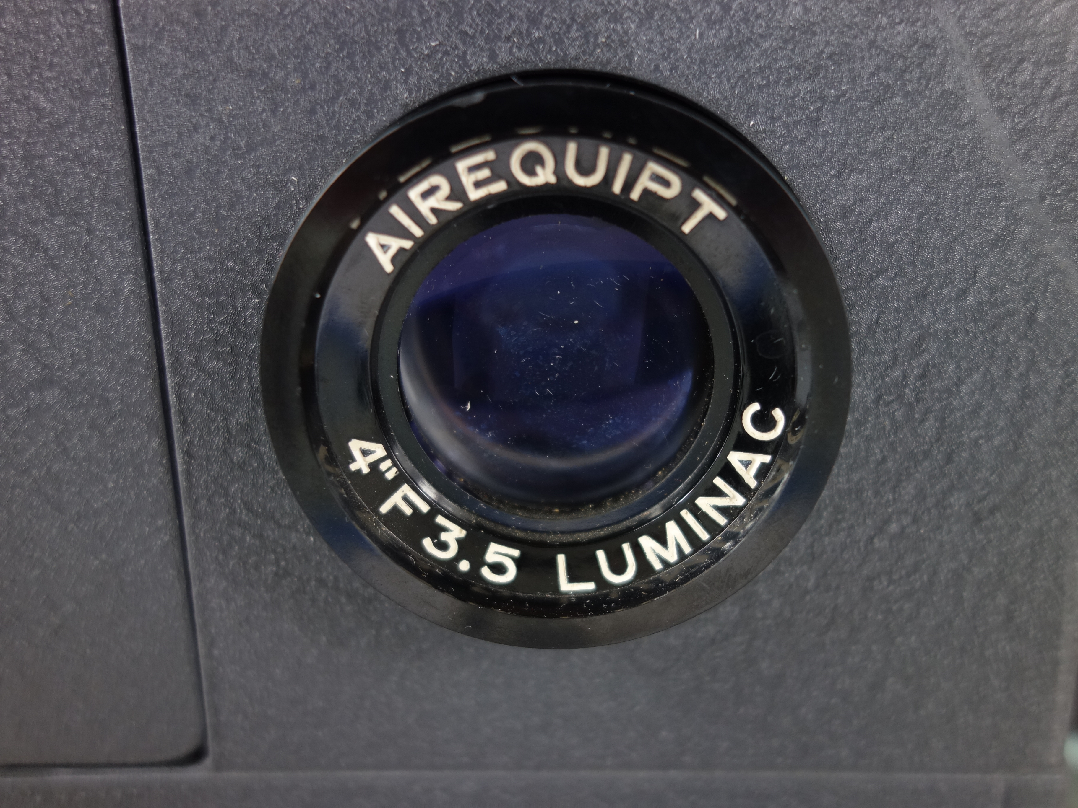 Projector and Vintage Tape Reels With News, Other Recordings