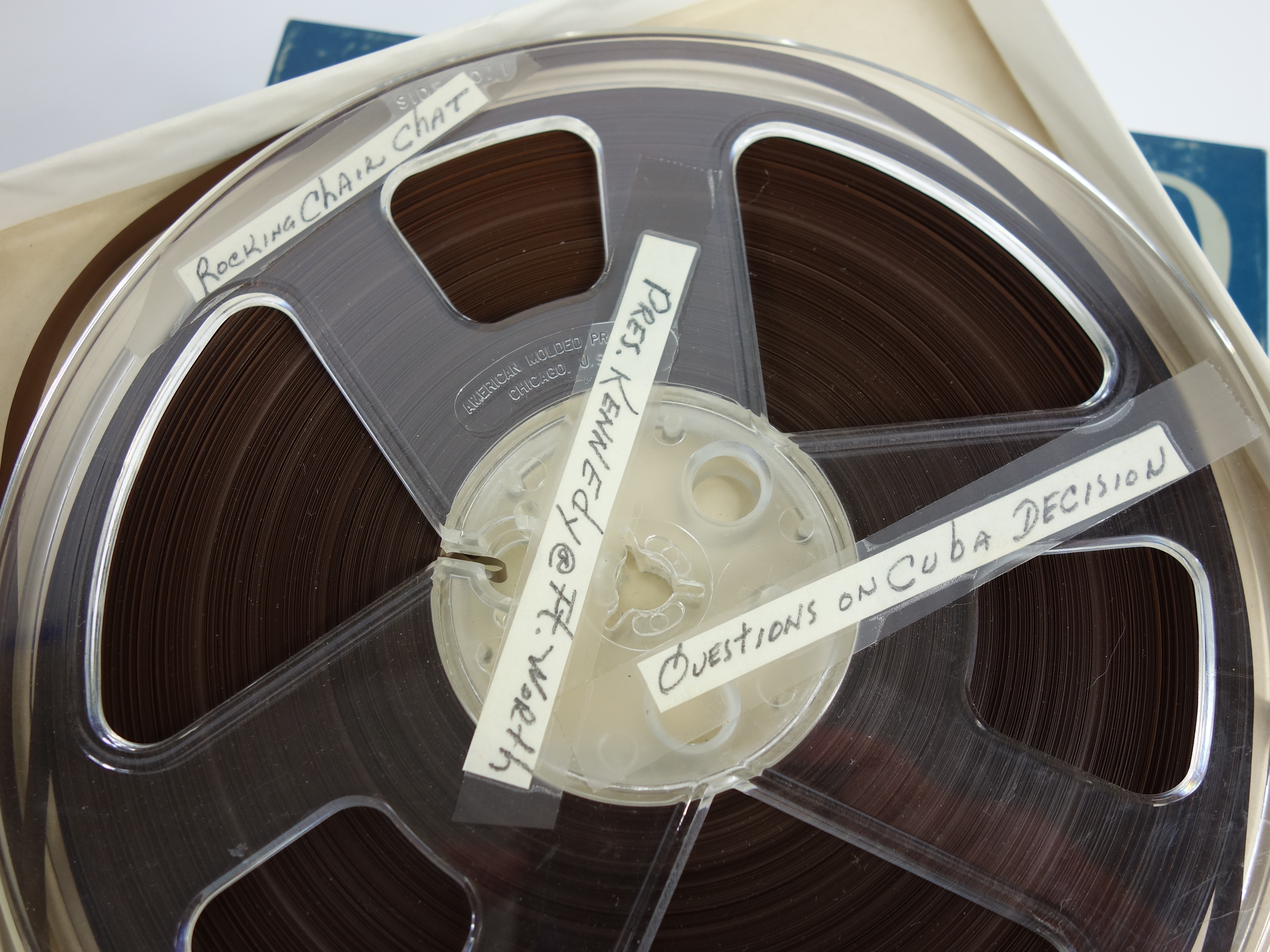 Projector and Vintage Tape Reels With News, Other Recordings