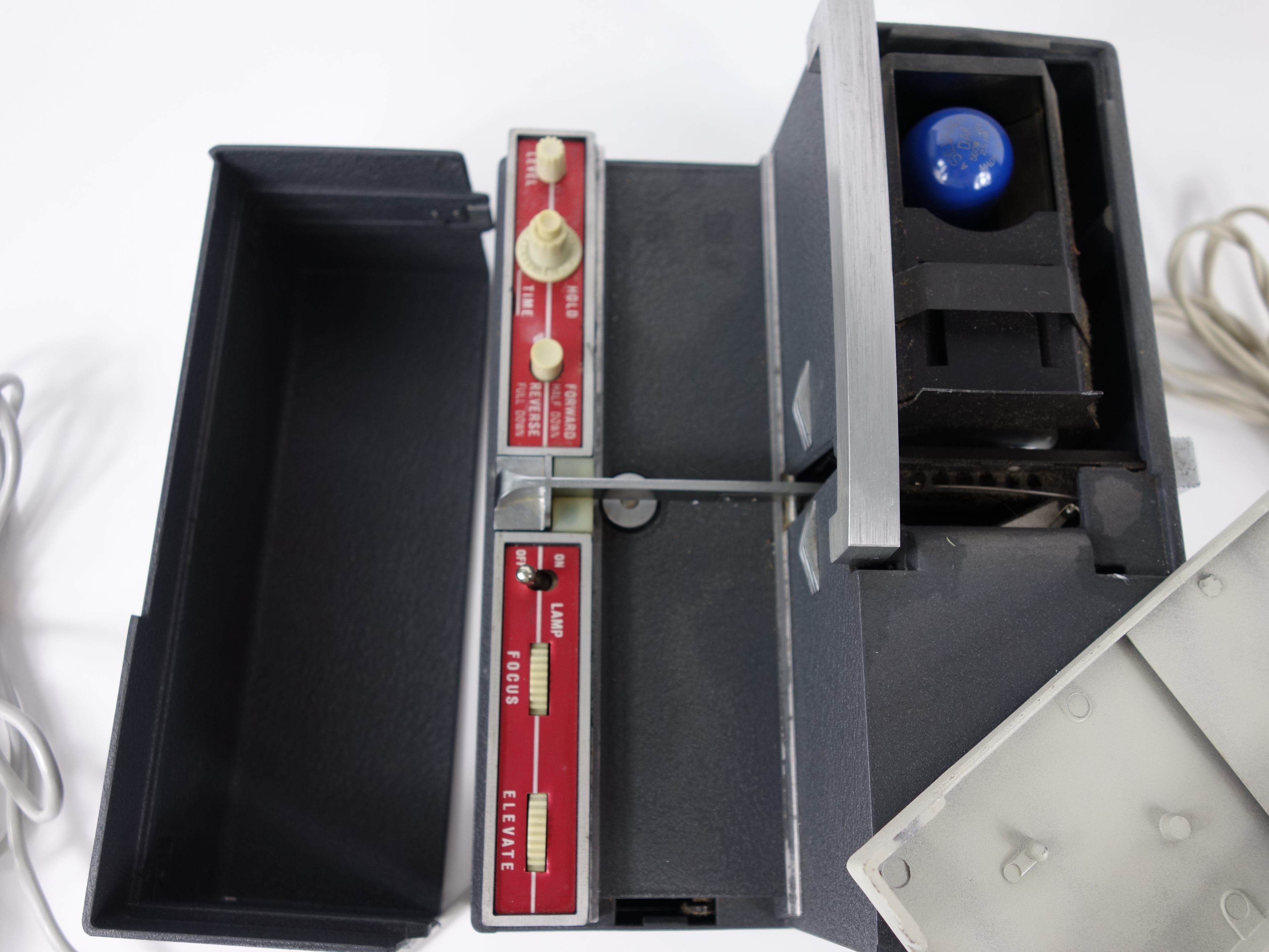 Projector and Vintage Tape Reels With News, Other Recordings