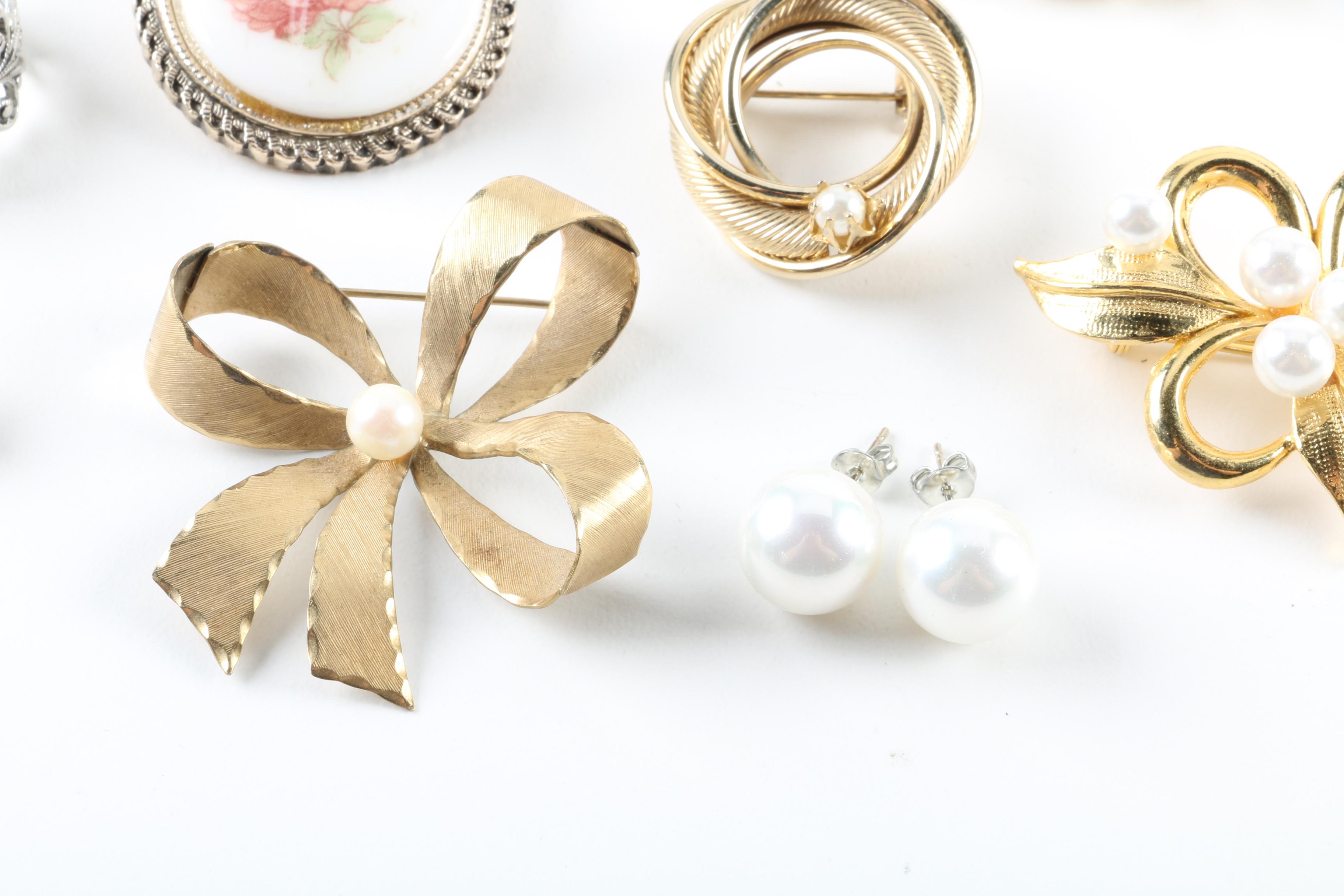 Floral Inspired Brooches, Rings, and Earrings