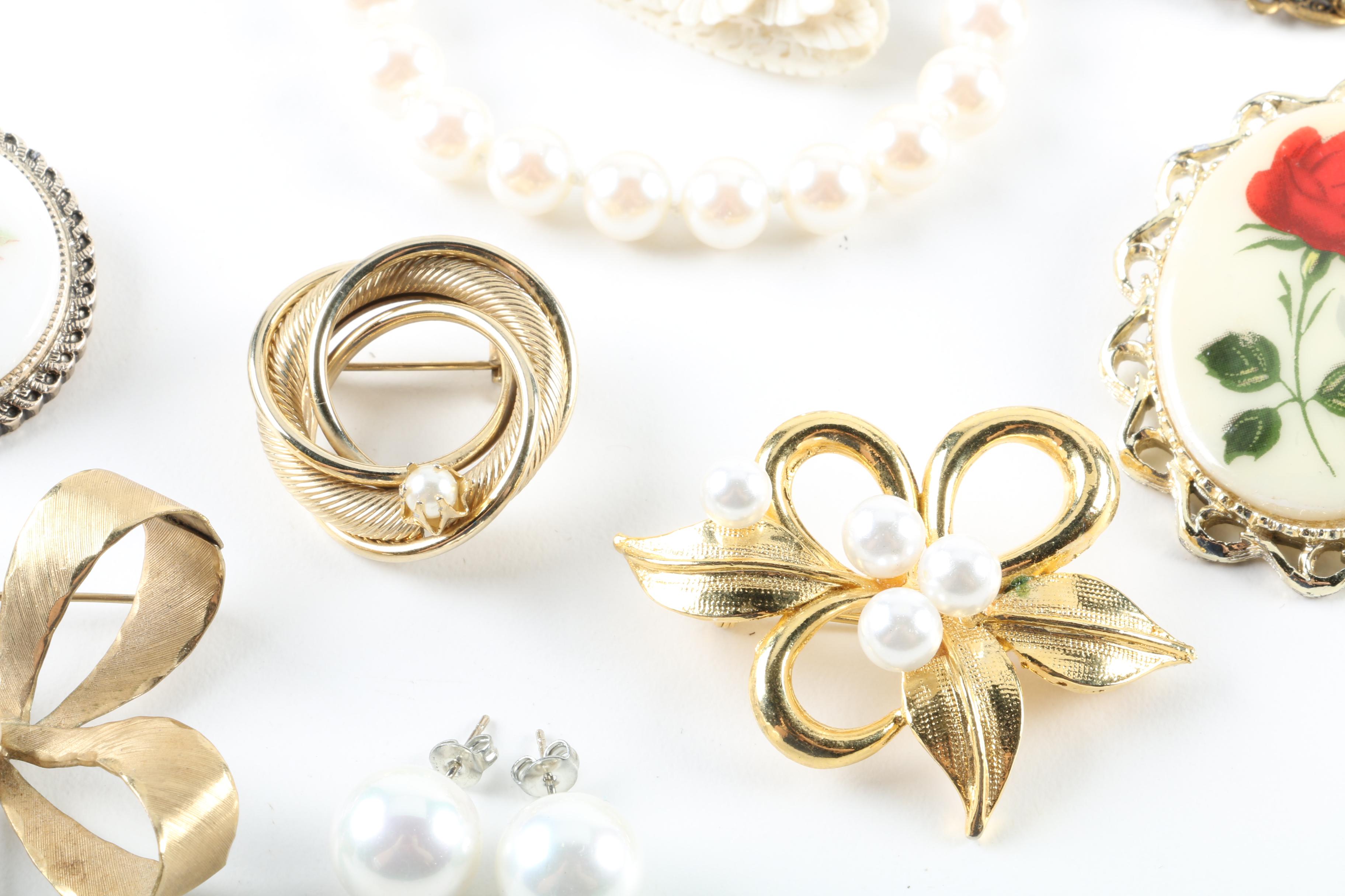 Floral Inspired Brooches, Rings, and Earrings