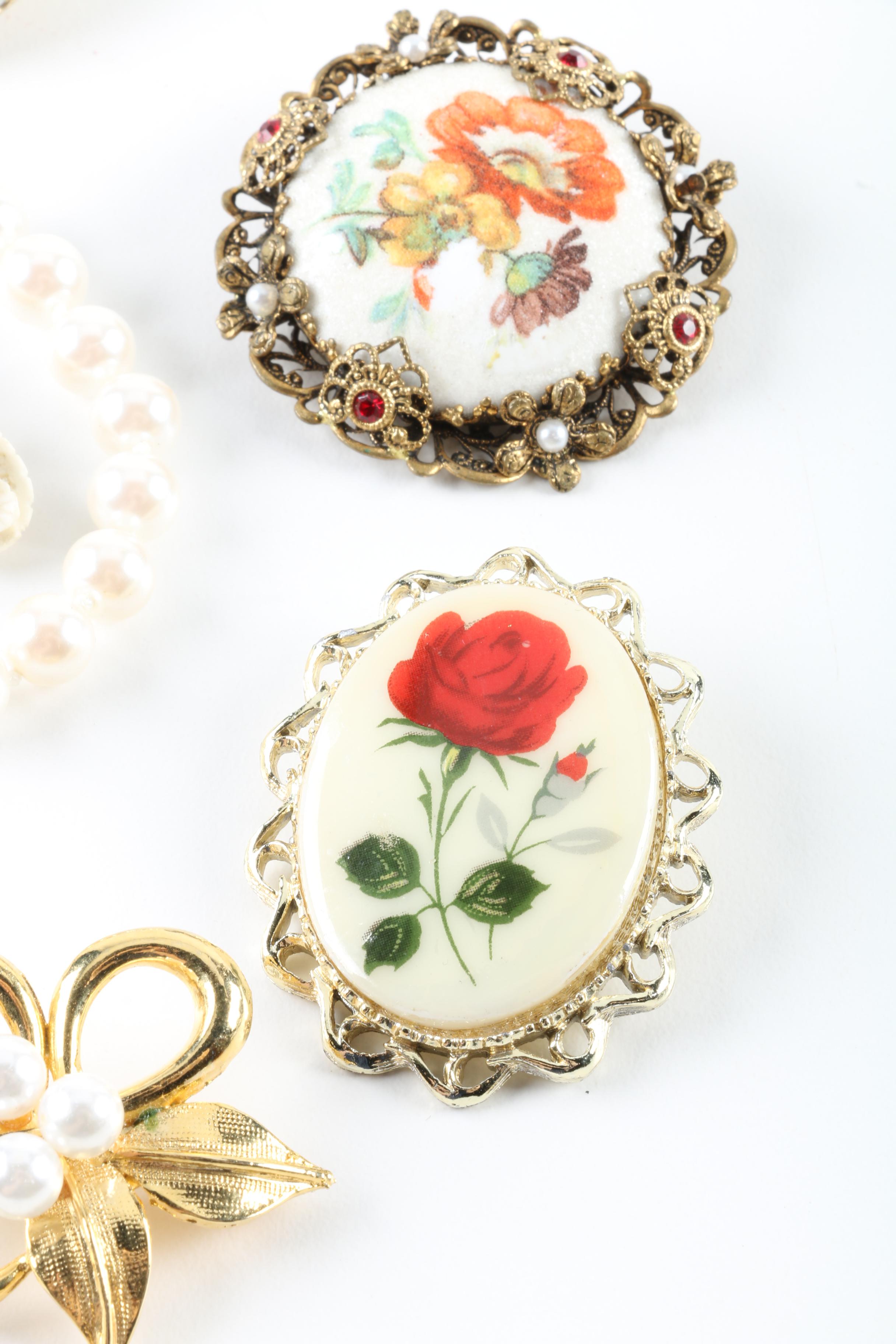 Floral Inspired Brooches, Rings, and Earrings