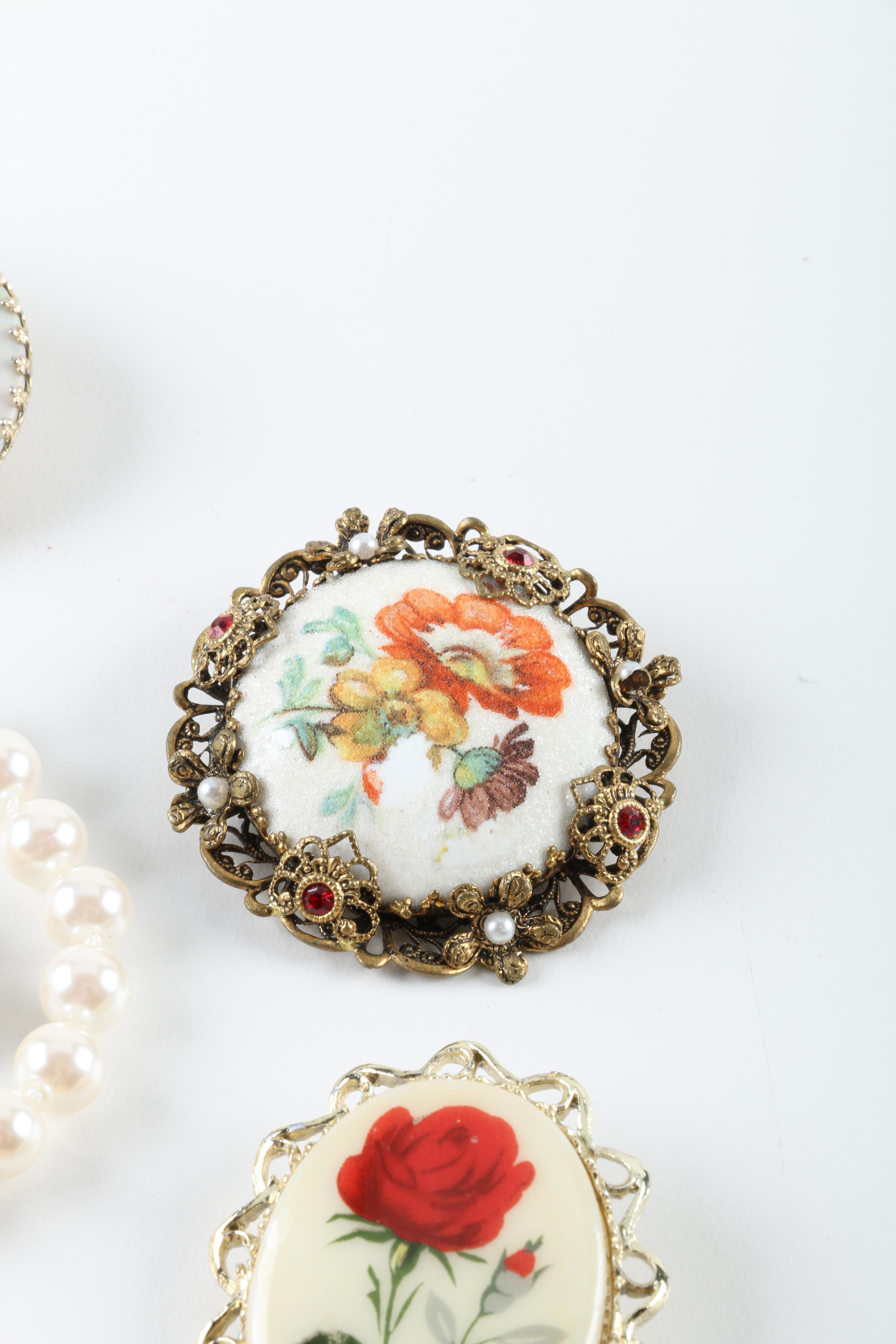 Floral Inspired Brooches, Rings, and Earrings
