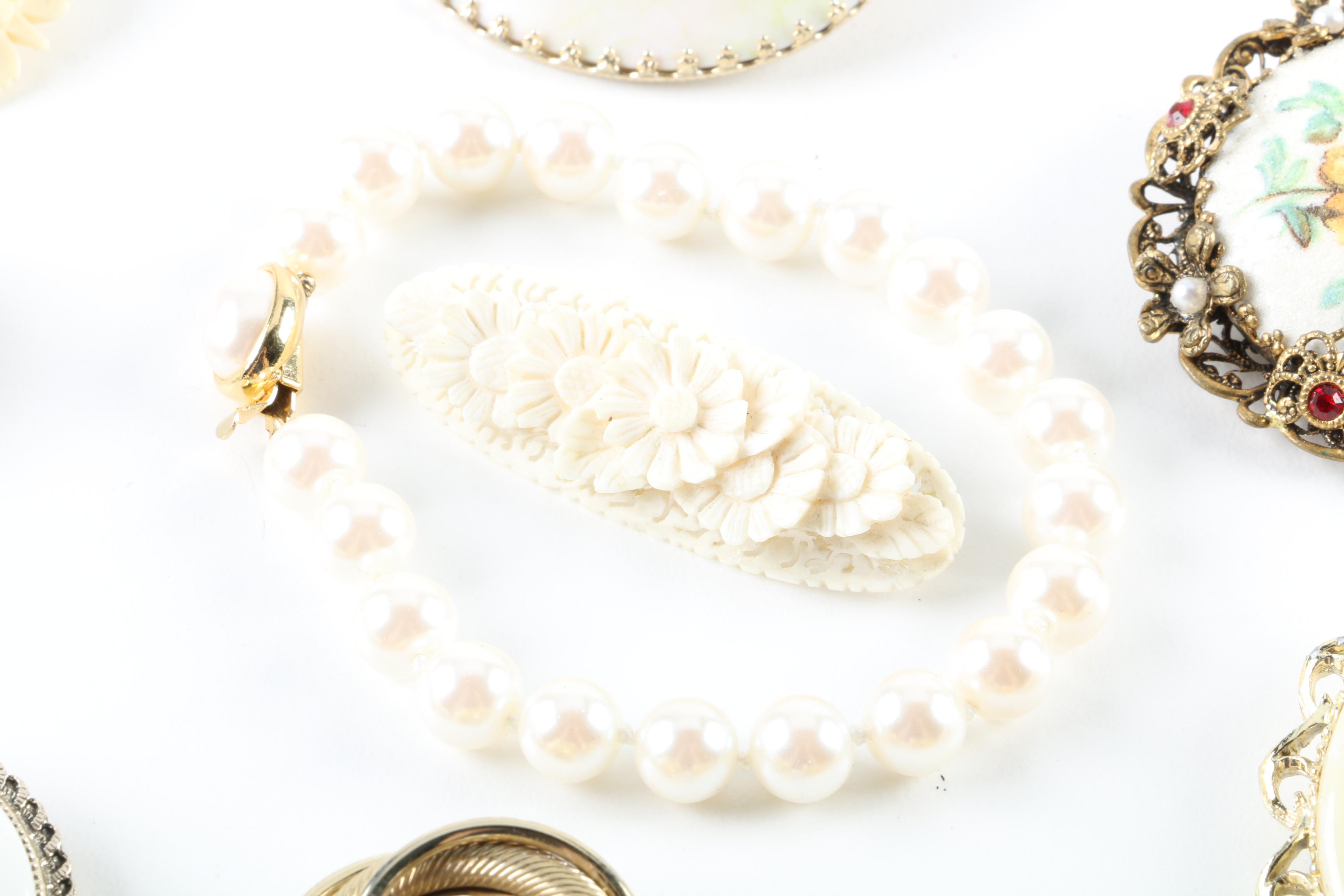 Floral Inspired Brooches, Rings, and Earrings