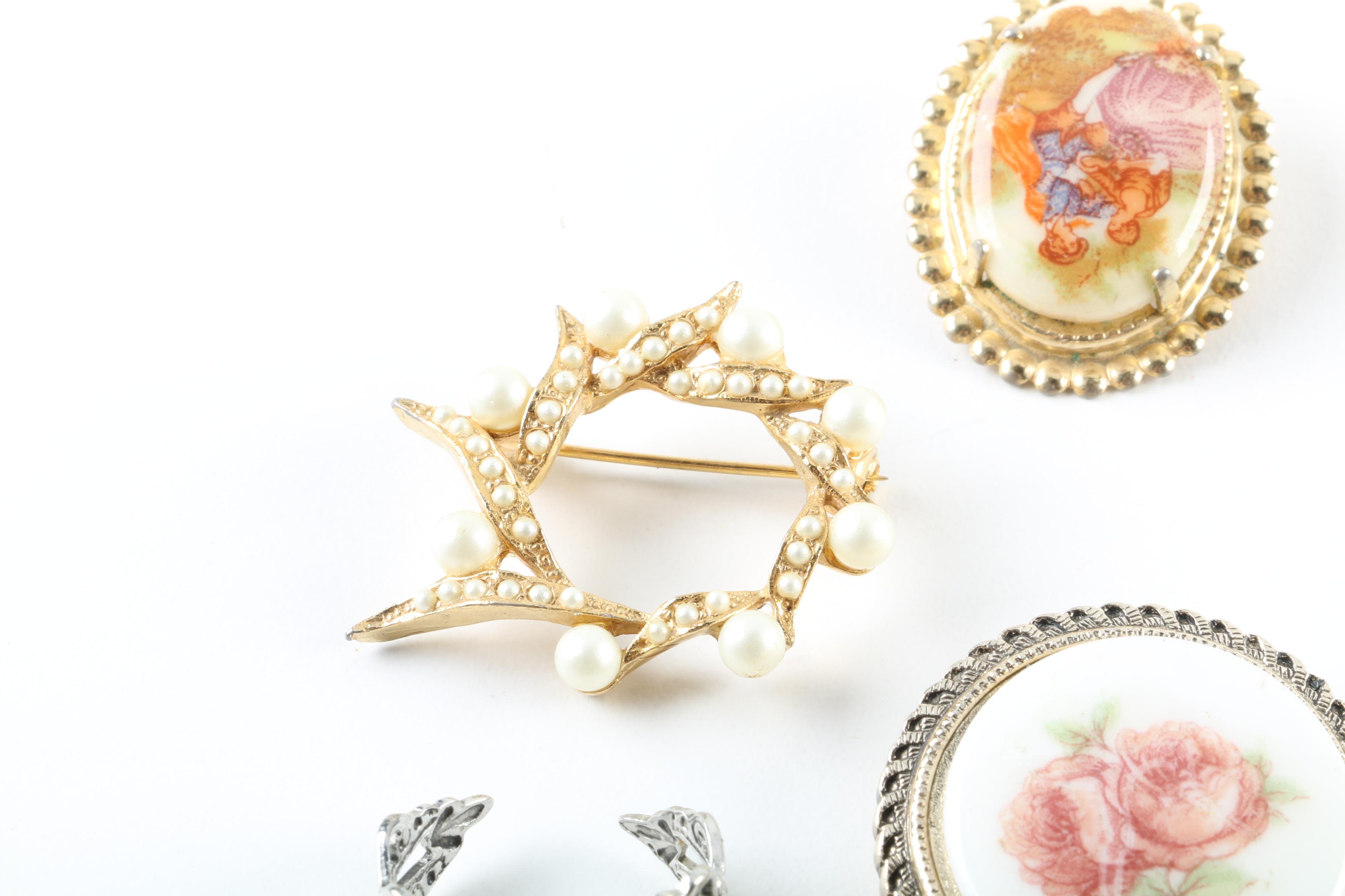 Floral Inspired Brooches, Rings, and Earrings