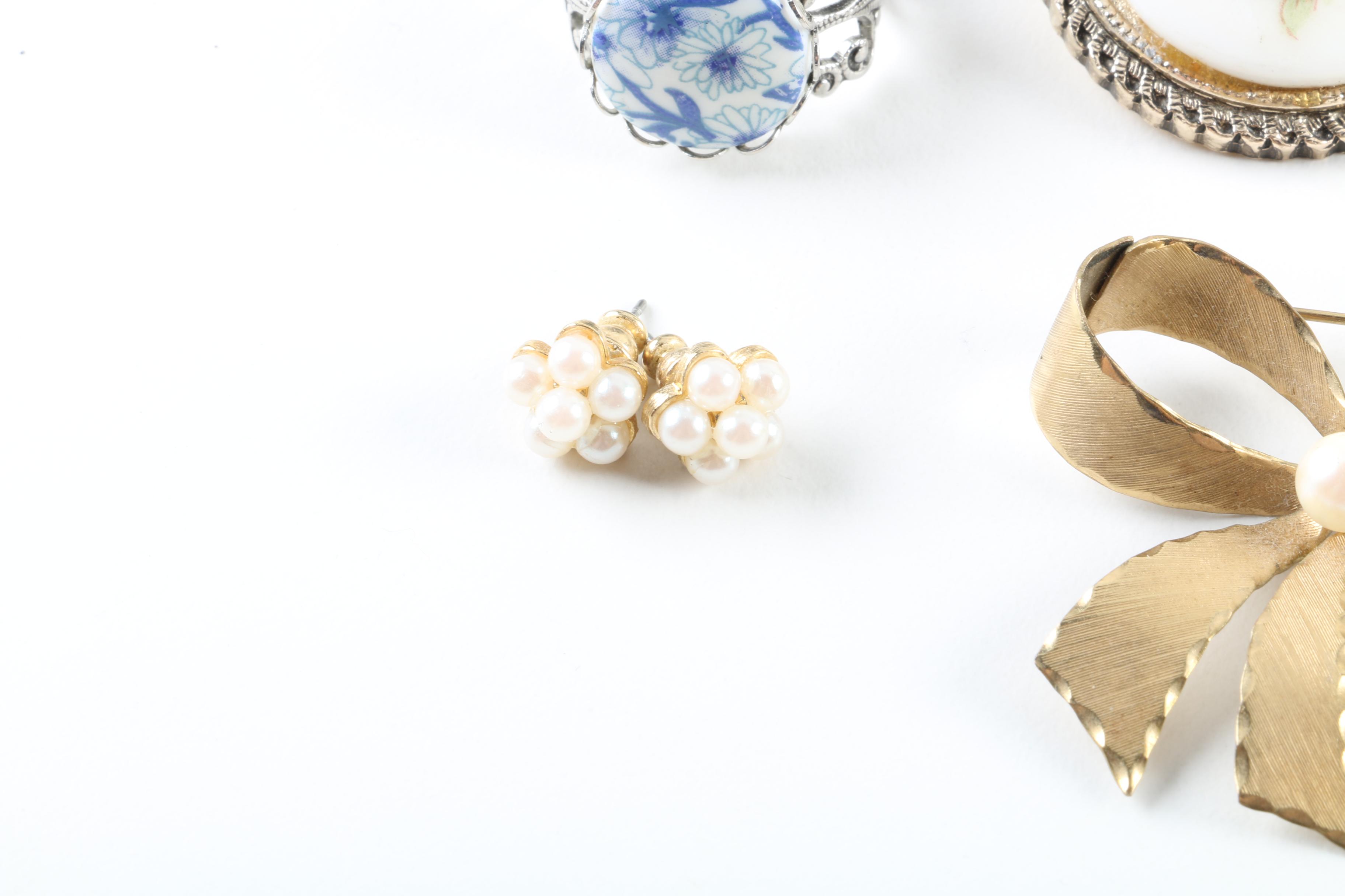 Floral Inspired Brooches, Rings, and Earrings