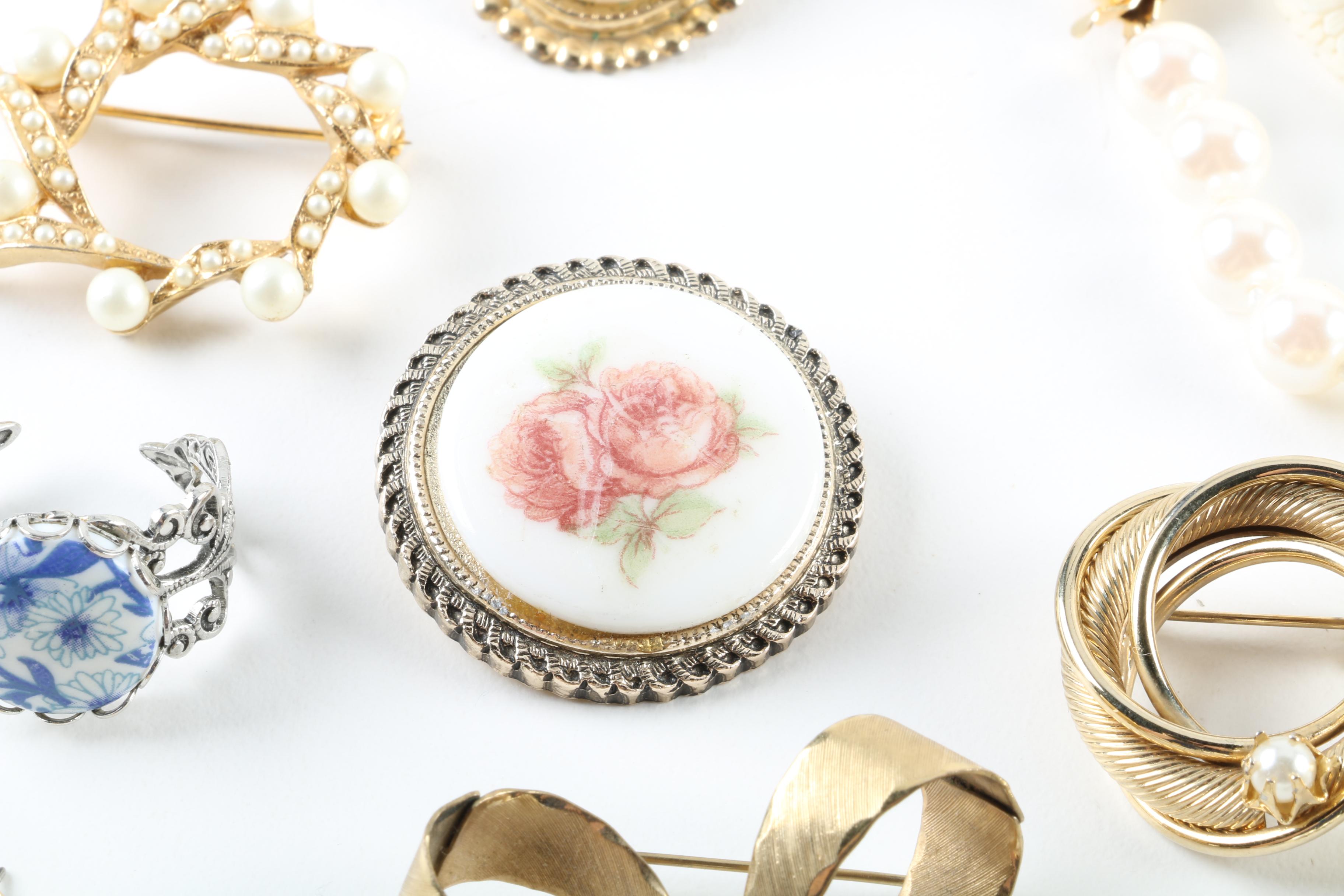 Floral Inspired Brooches, Rings, and Earrings